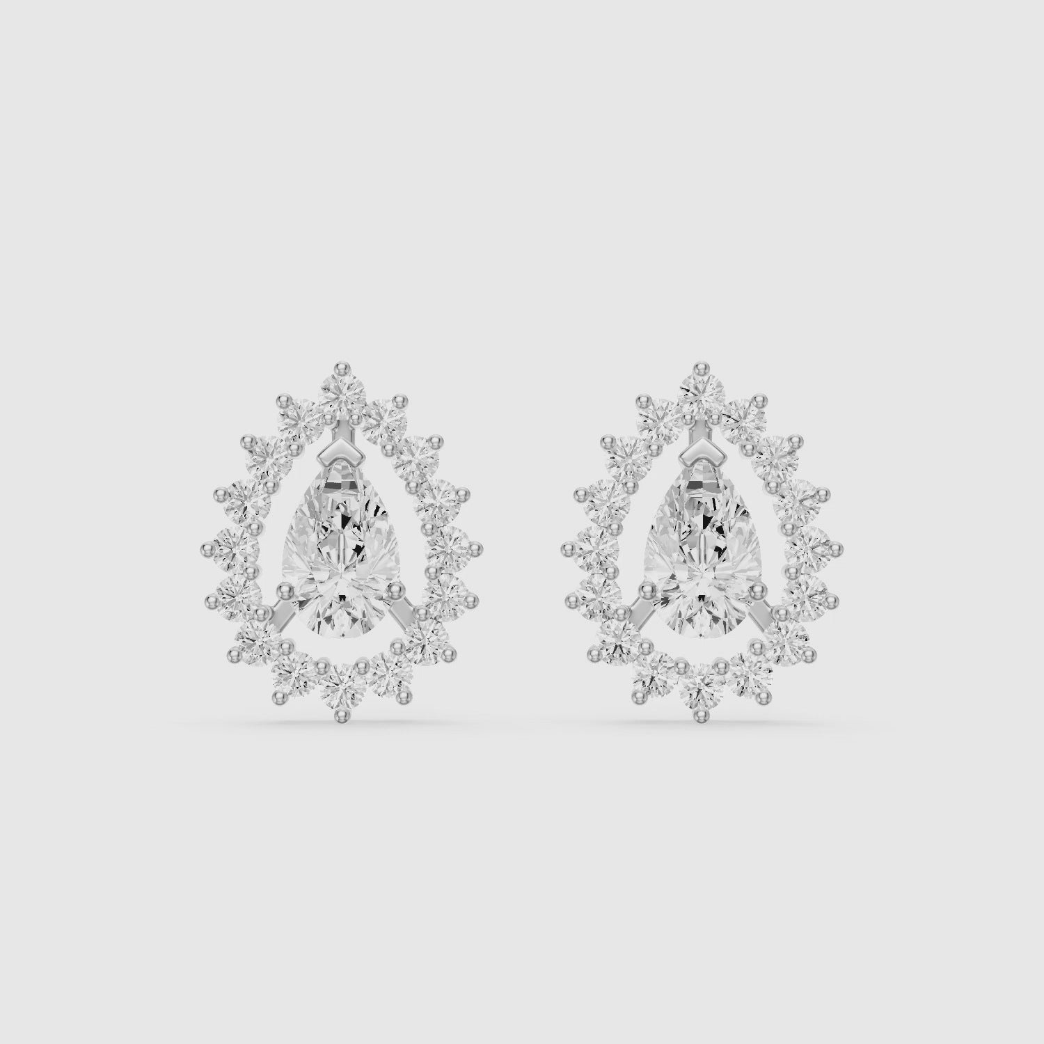 Load video: Zana Pear and Round Lab Grown Diamond Halo Stud Earrings