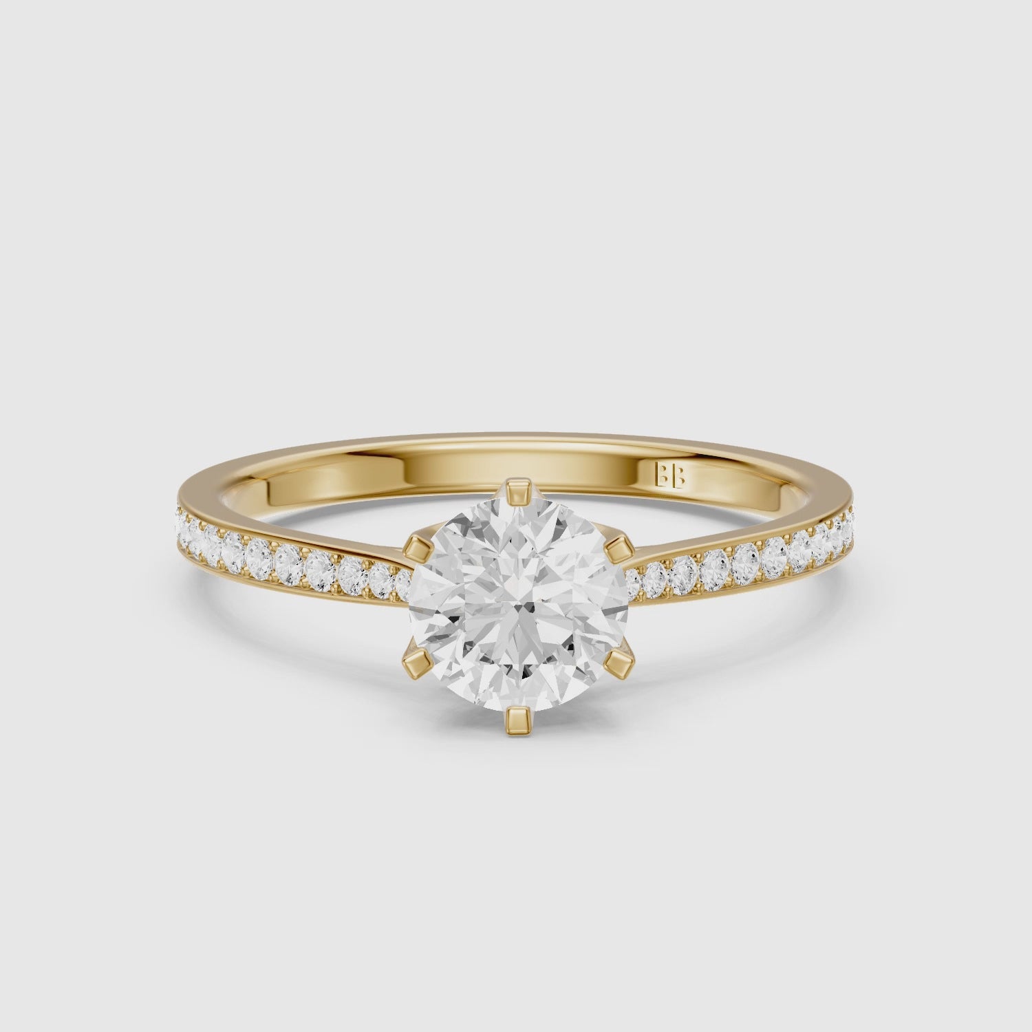 Load video: Desire 6 Prong Round Cut Side Stone Channel Set Moissanite Diamond Ring