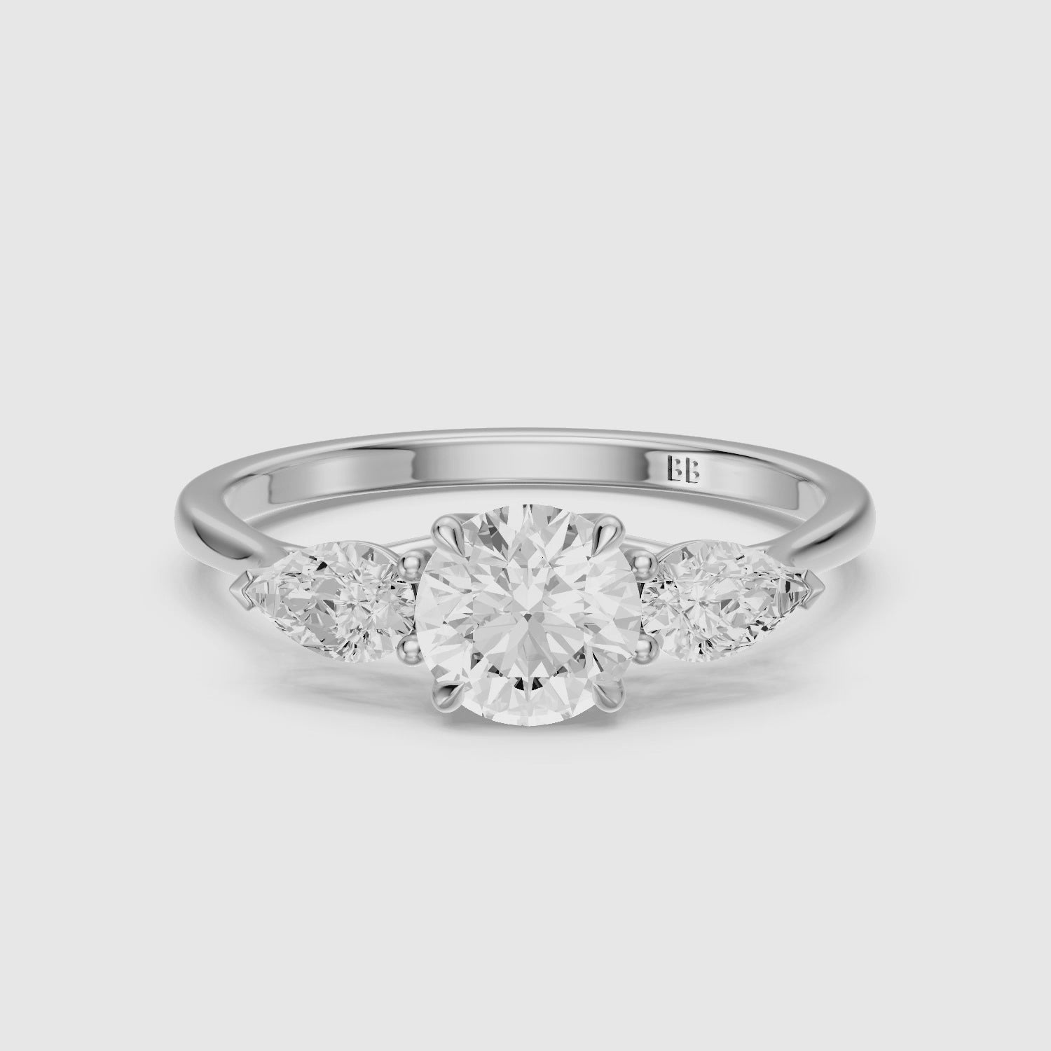 Load video: Emmill Three Stone Round Cut Lab Grown Diamond Ring WIth Pear Side Stone