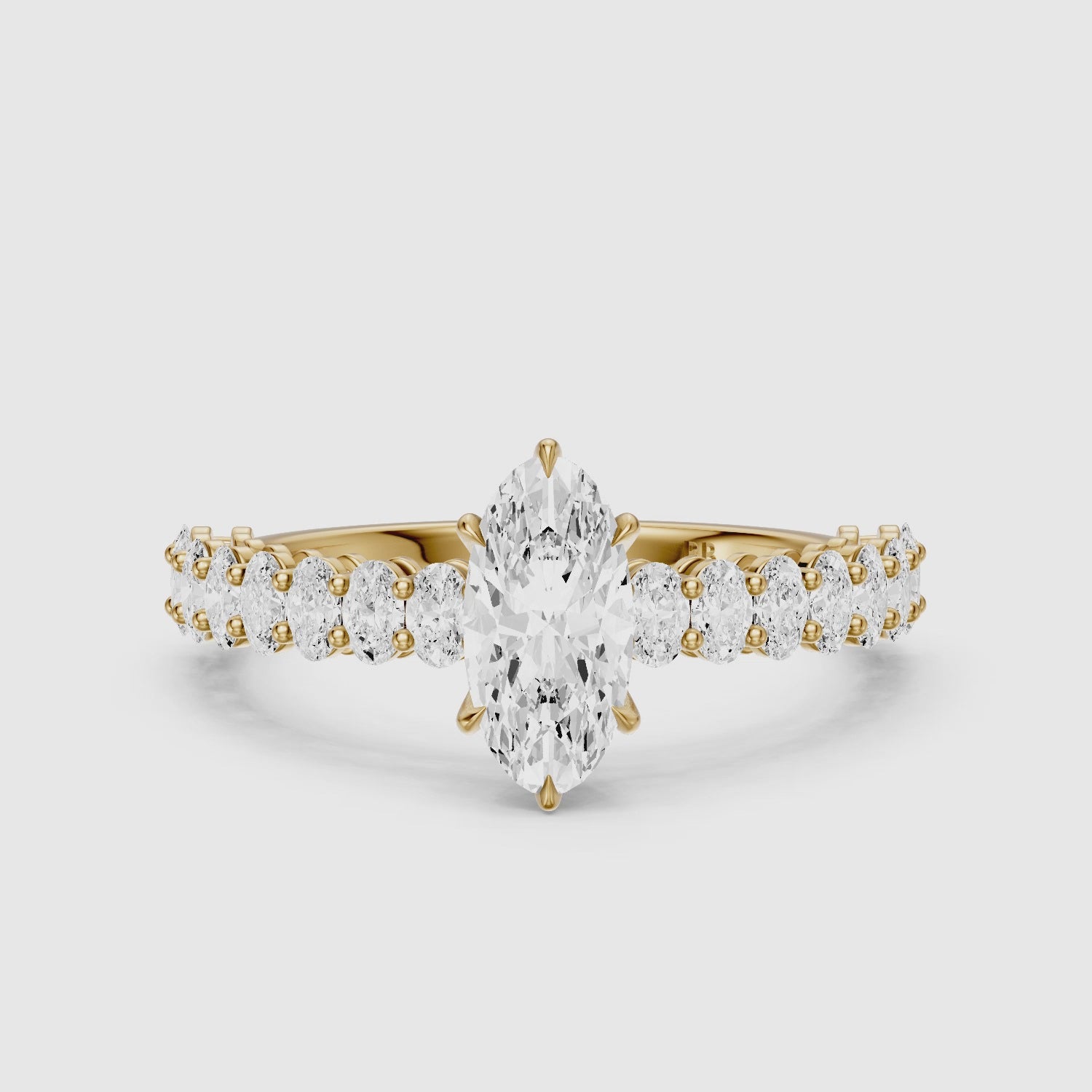 Load video: Sybil Moval Cut Moissanite Diamond Ring with Oval Side Diamond Band