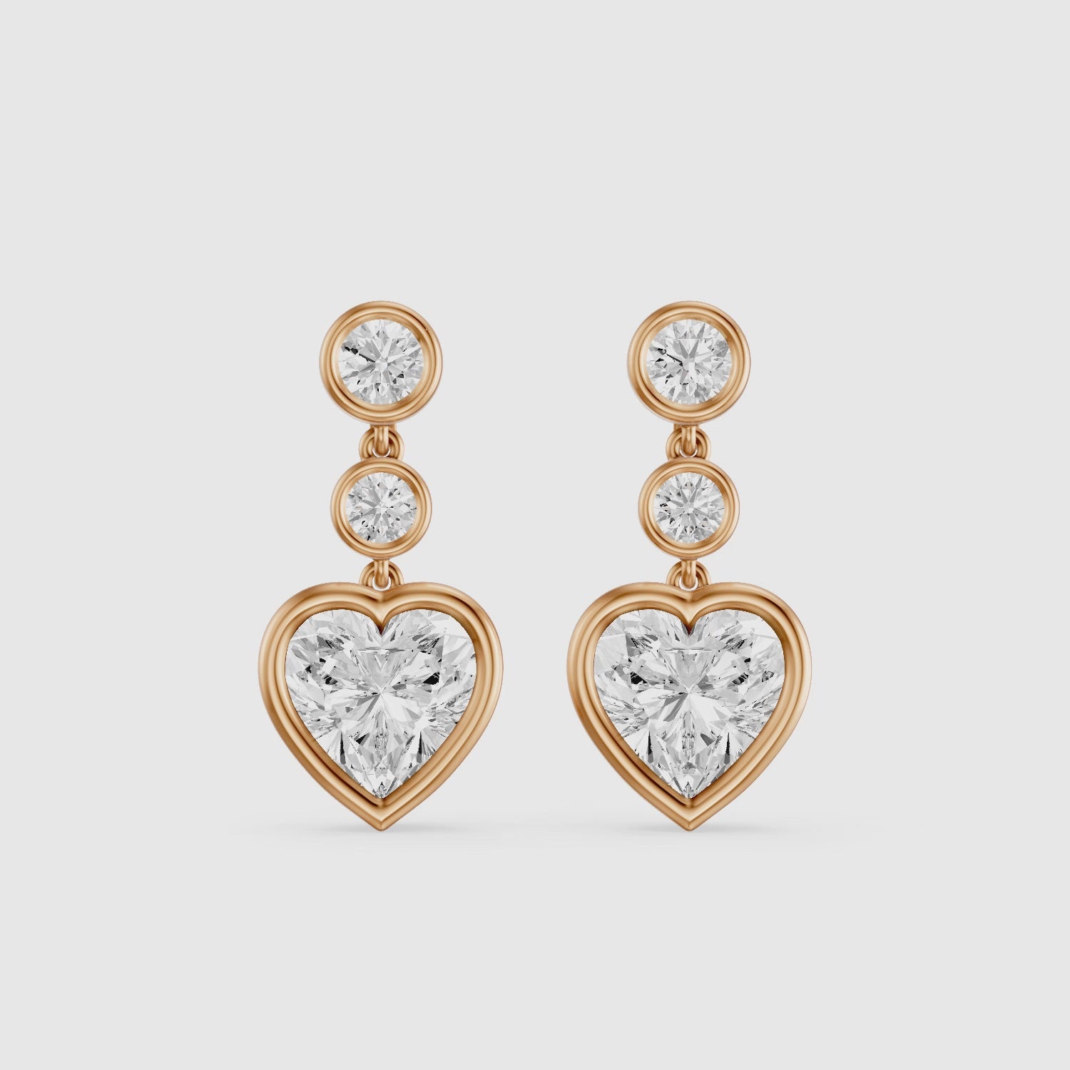 Load video: Ava Heart Shape and Round Lab Grown Diamond Bezel Drop Earrings