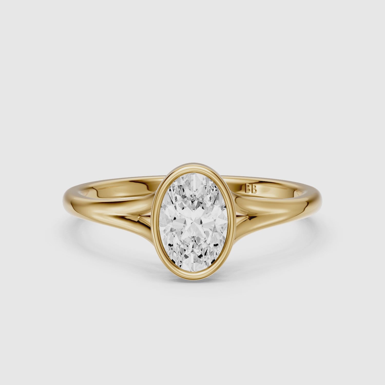 Load video: Ember Oval Cut Lab Grown Diamond Ring in Bezel Set Split Shank Style