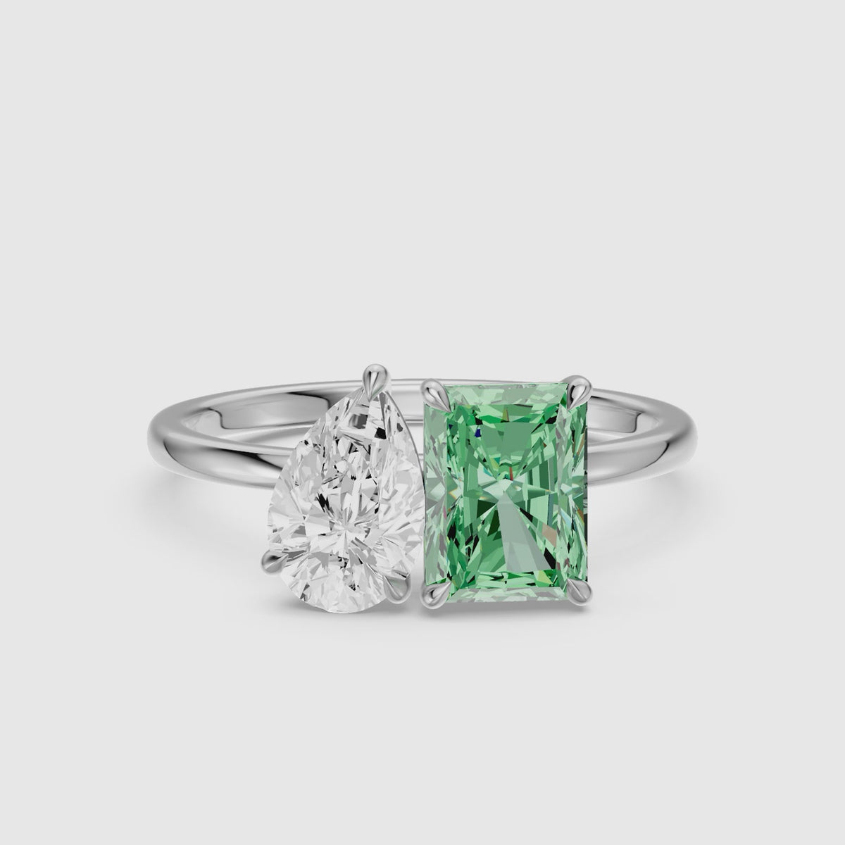 Load video: Cybele Green Radiant and Pear Cut Colored Lab Grown Diamond Toi et Moi Ring