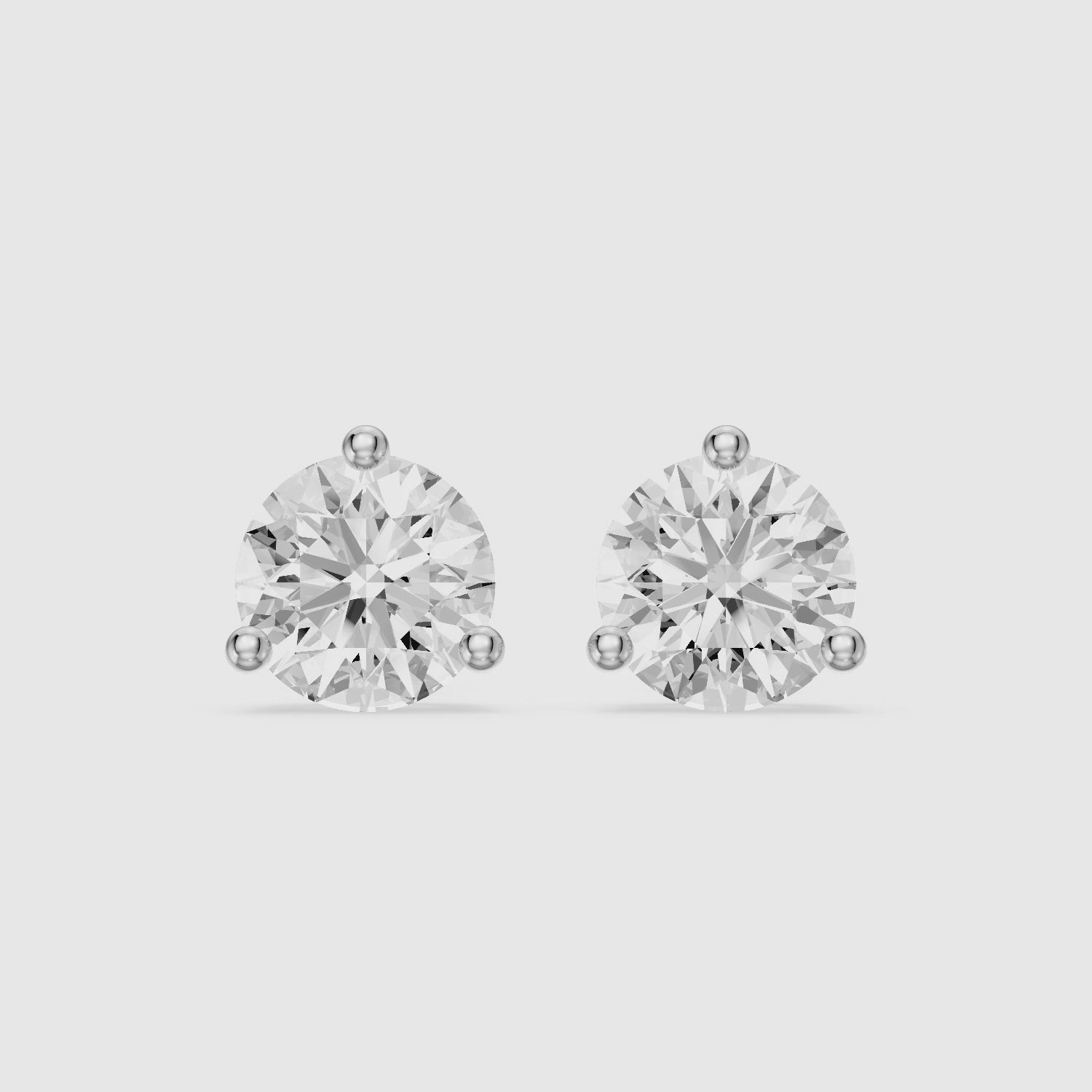 Load video: Daria Round Cut Lab Diamond Three Prong Solitaire Stud Earrings