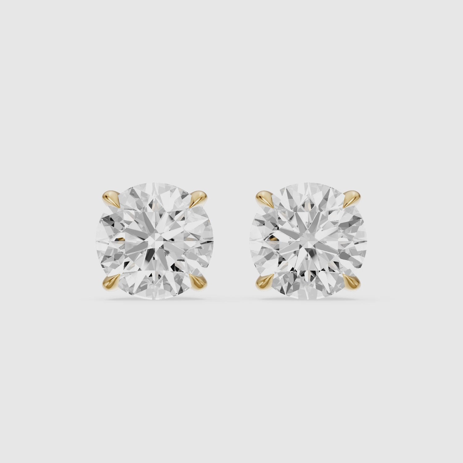 Load video: Roos Round Cut Lab Grown Diamond Four Prong Martini Earrings