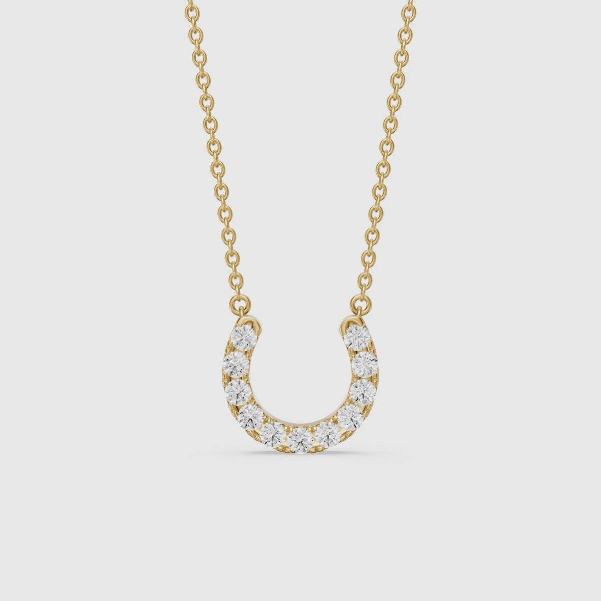 Load video: Amina Round Cut Lab Grown Diamond Horseshoe Pendant