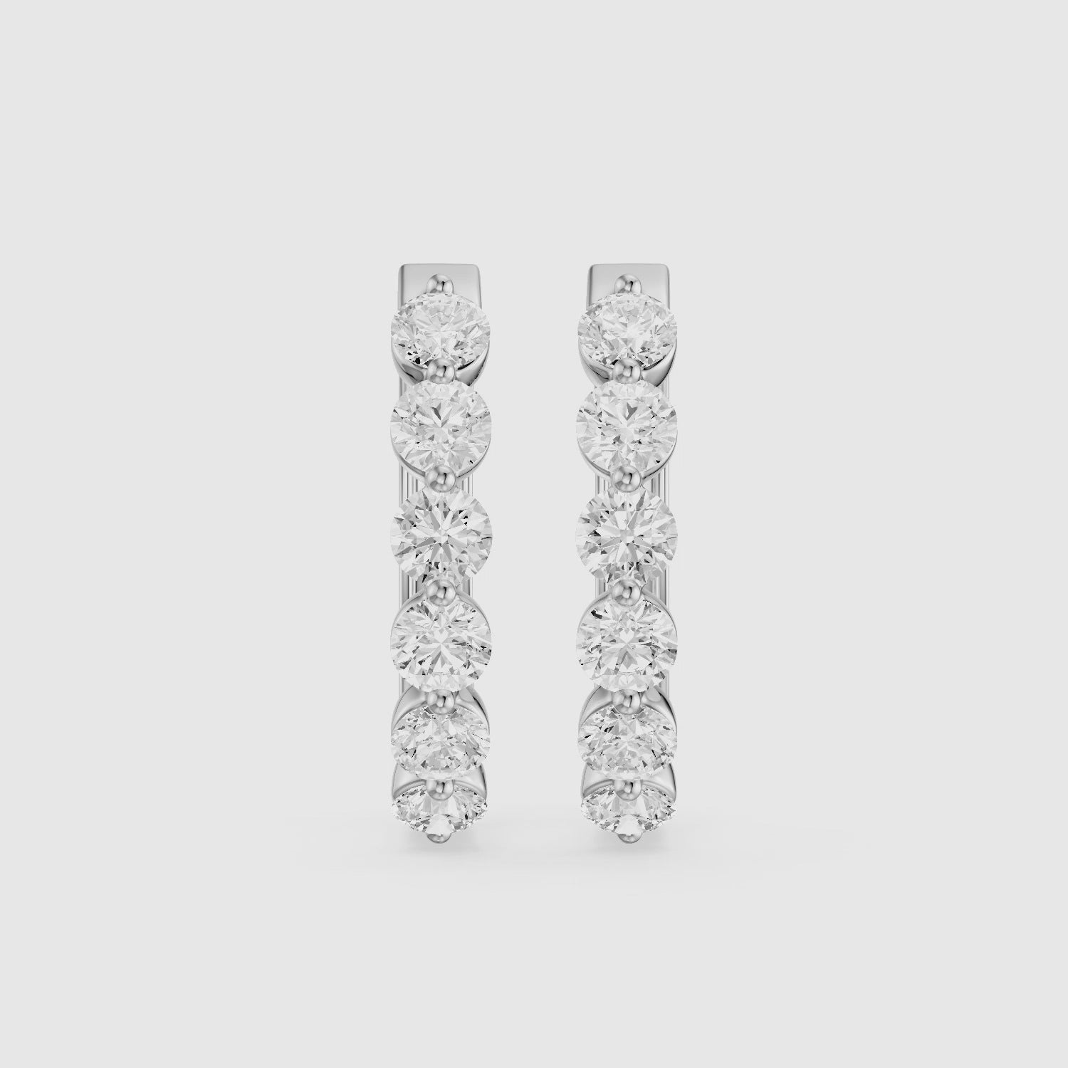 Load video: Yvette Round Cut Lab Grown Diamond Shared Prong Hoop Earrings