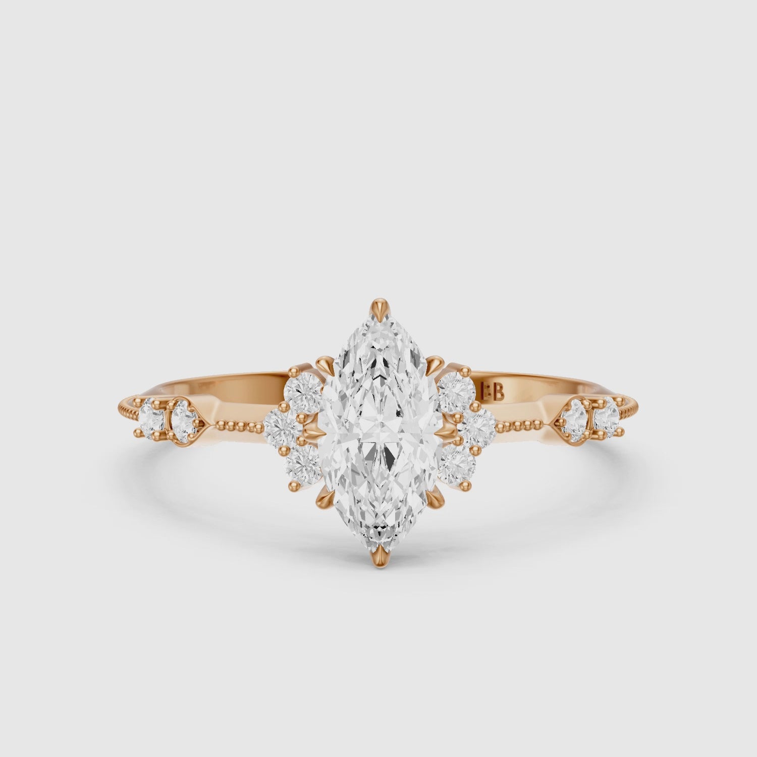 Load video: Wren Marquise Moissanite Diamond Ring with Cluster Side Stones and Vintage Band