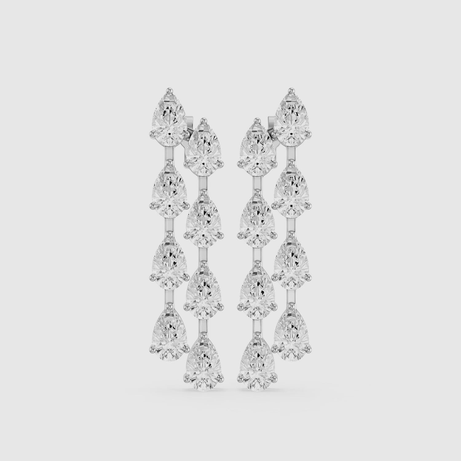 Load video: Eadie Cascading Pear Shaped Lab Grown Diamond Dangle Earrings