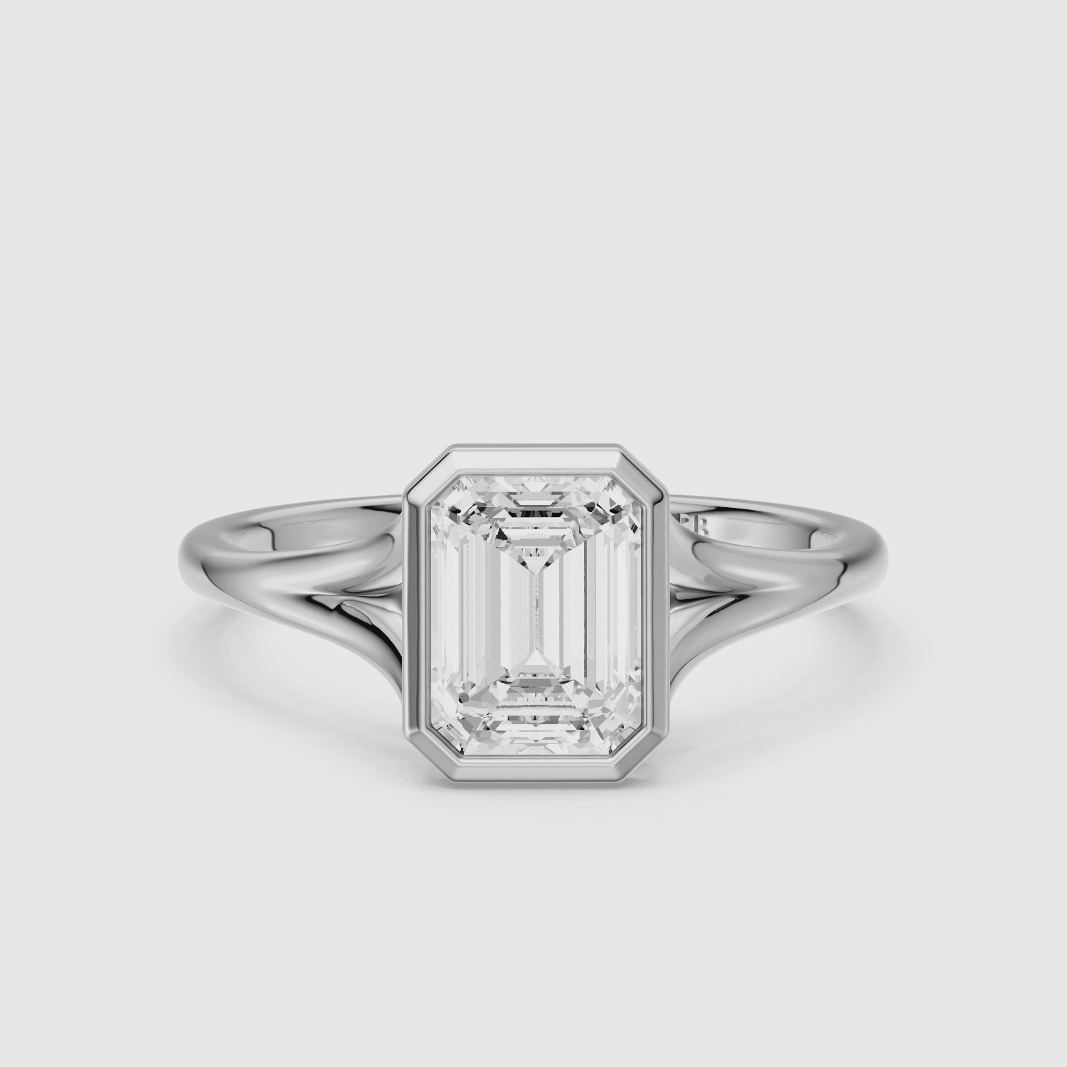 Load video: Milani Emerald Cut Lab Grown Diamond Bezel Solitaire Ring with Split Band