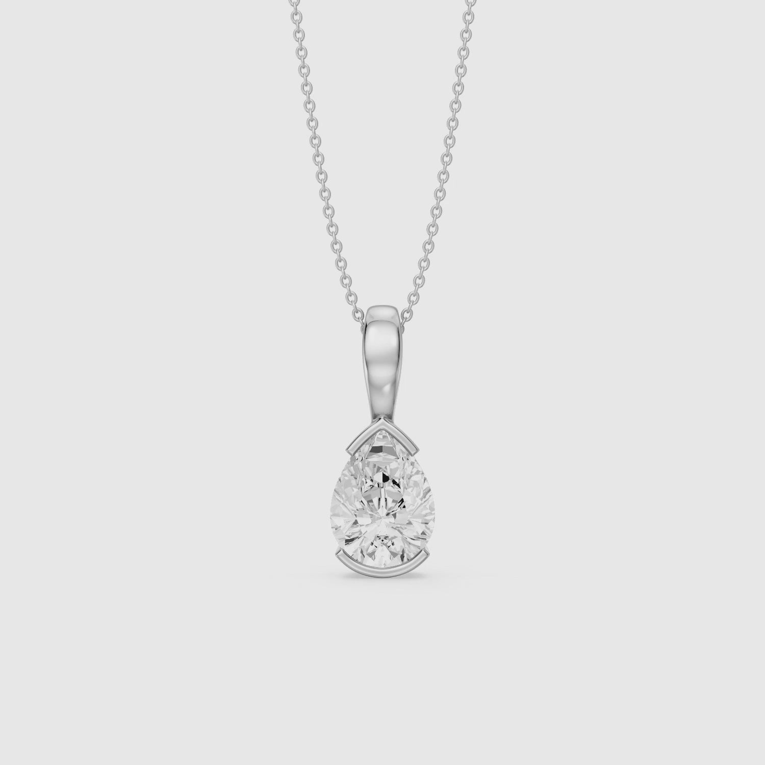 Load video: Adriana Pear Shape Lab Grown Diamond Half Bezel Pendant