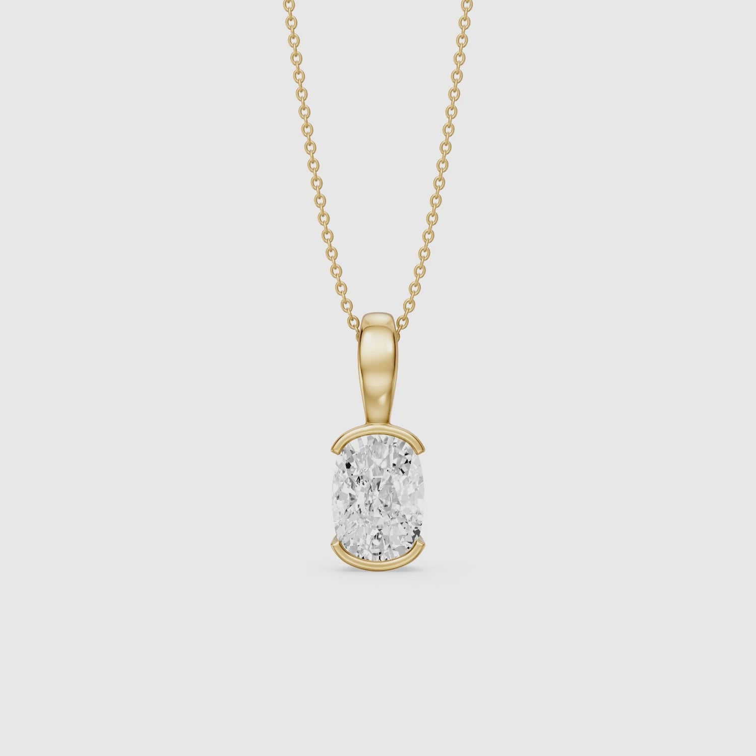 Load video: Raya Elongated Cushion Half Bezel Lab Grown Diamond Pendant
