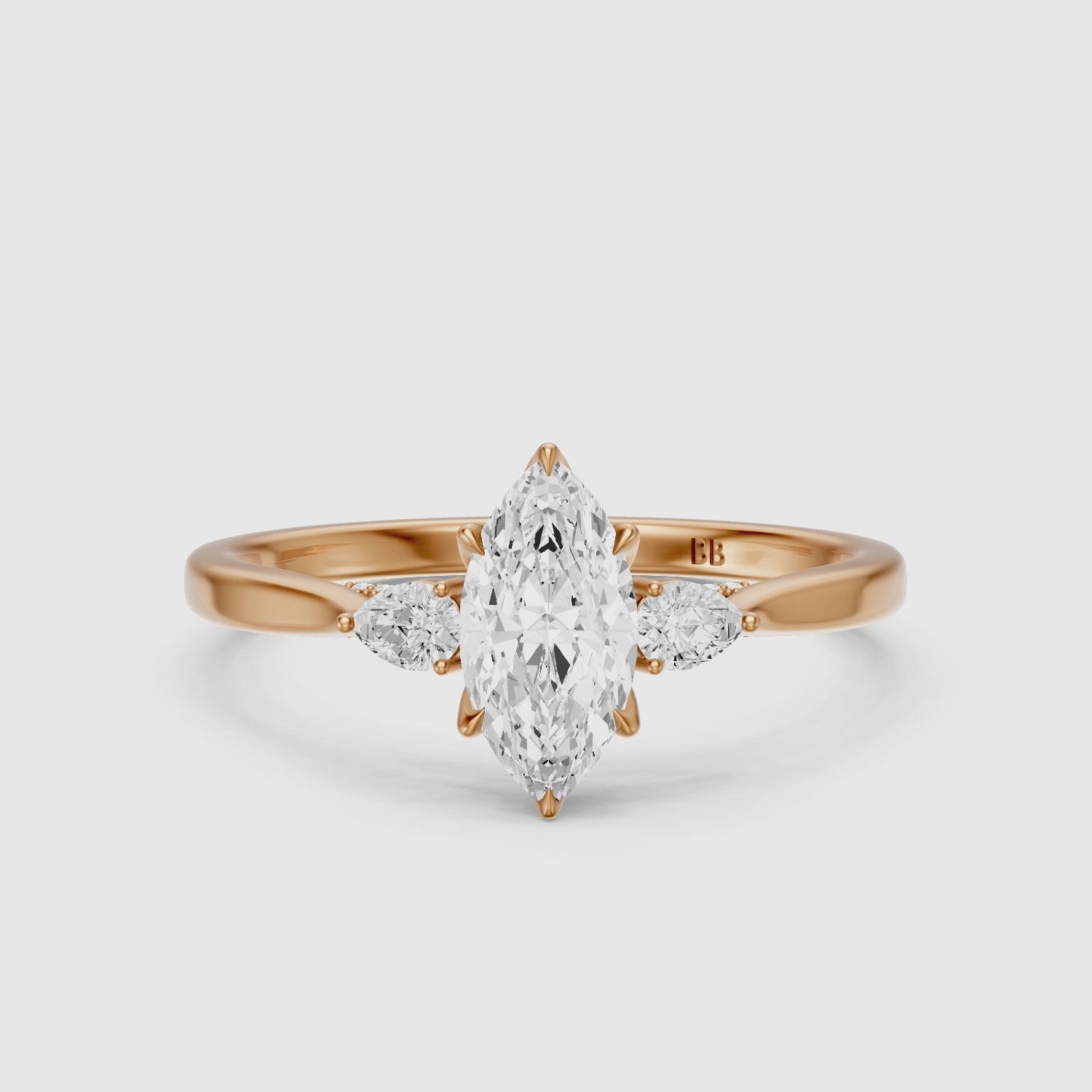Load video: Hazel Marquise Three Stone Moissanite Ring in Tulip Cathedral Setting