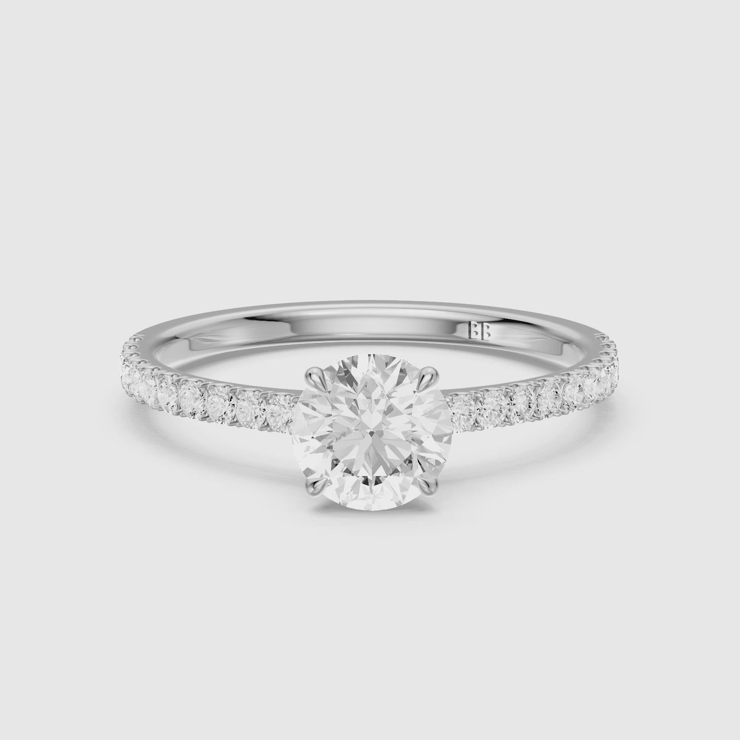 Load video: Tinsly Round Cut Side Stone Pave Moissanite Engagement Ring