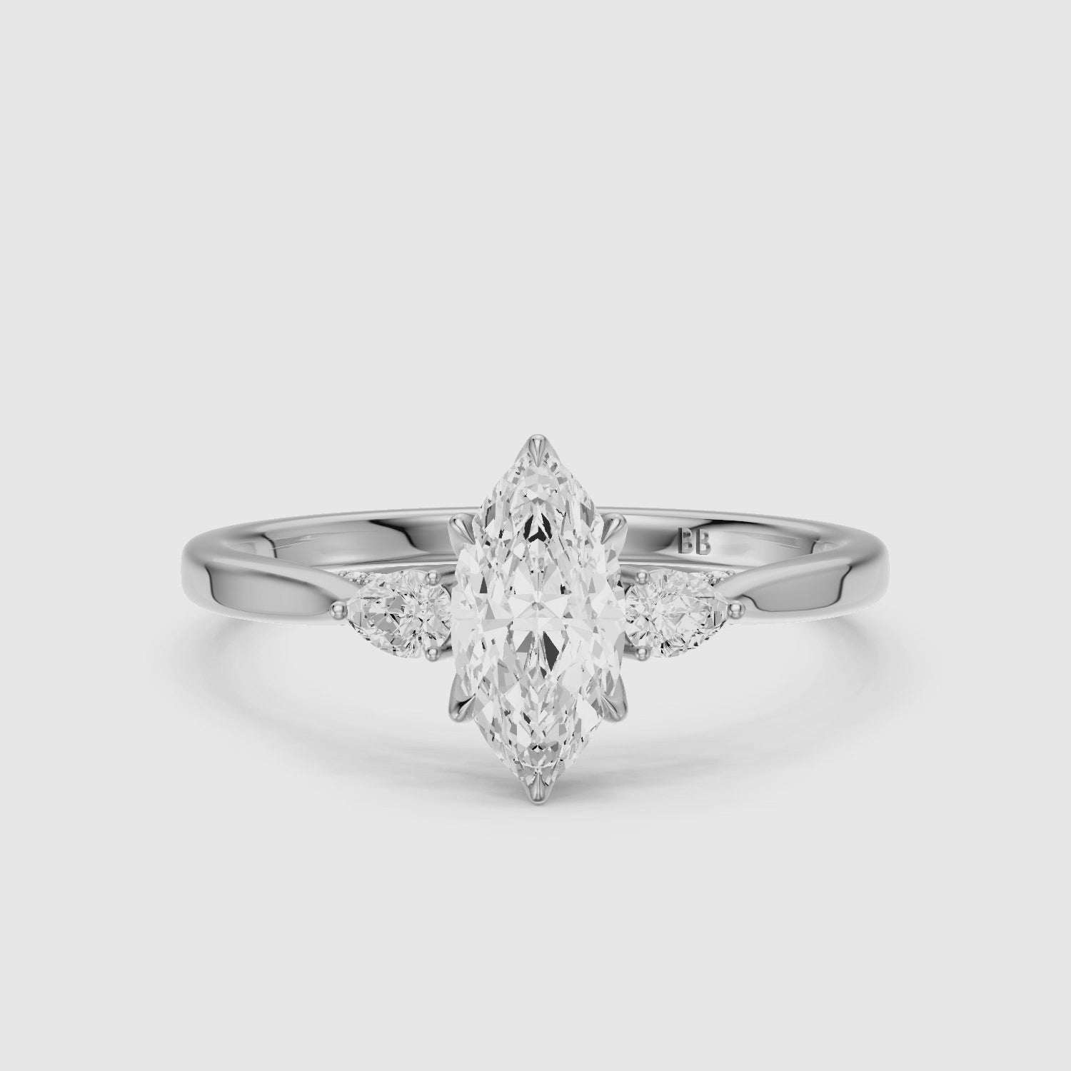 Load video: Hazel Marquise Three Stone Moissanite Ring in Tulip Cathedral Setting
