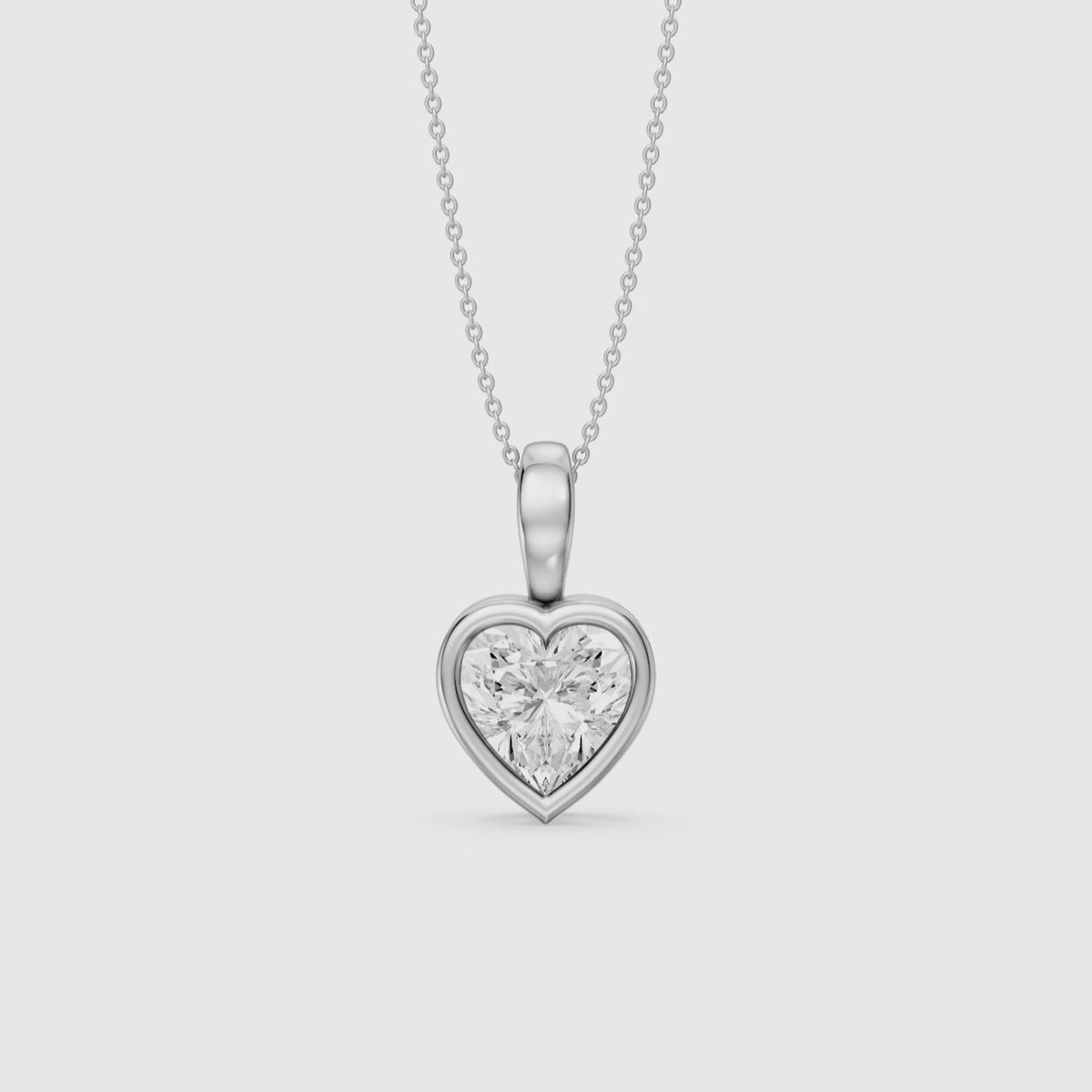 Load video: Anne Heart Shape Bezel Set Lab Grown Diamond Solitaire Pendant