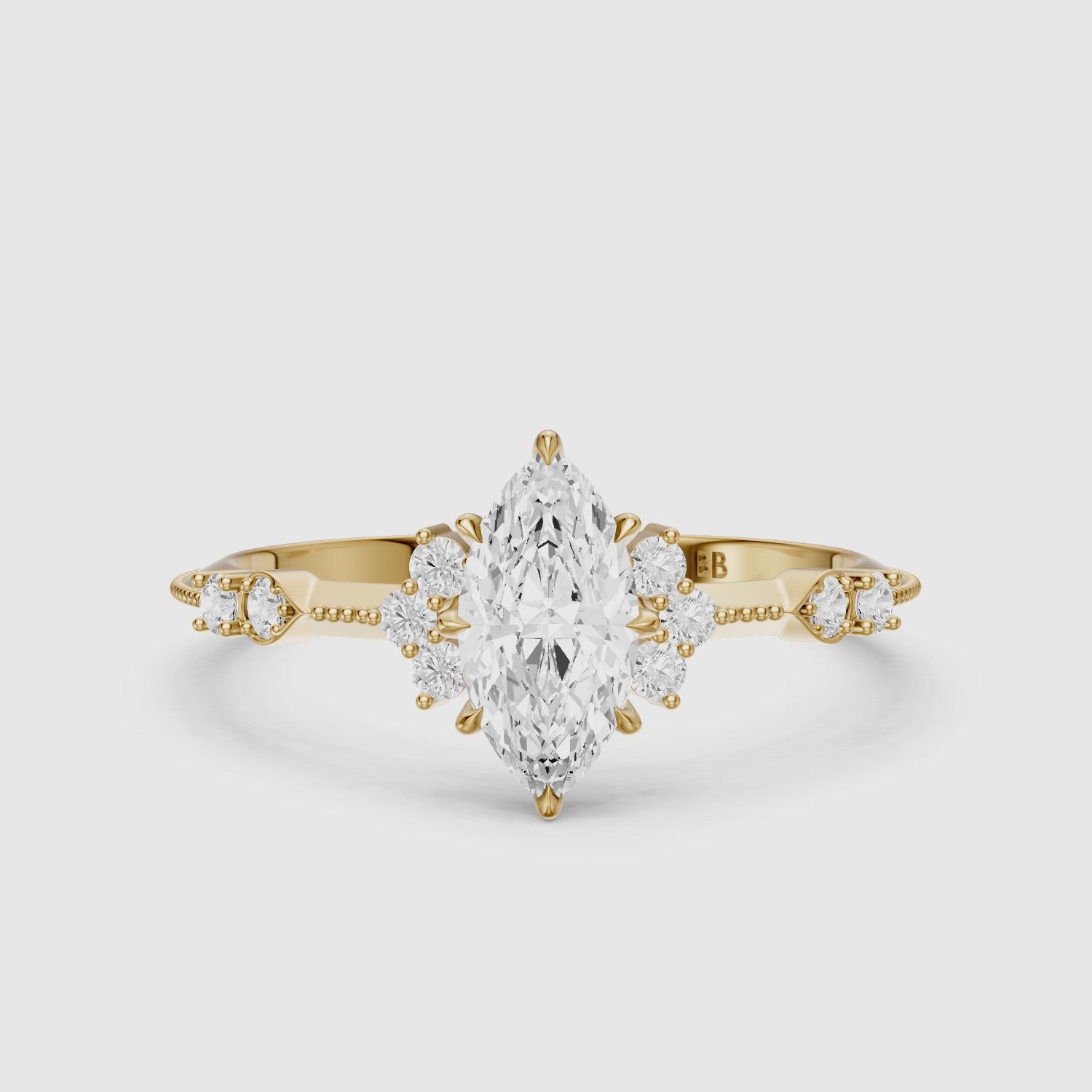 Load video: Wren Marquise Moissanite Diamond Ring with Cluster Side Stones and Vintage Band