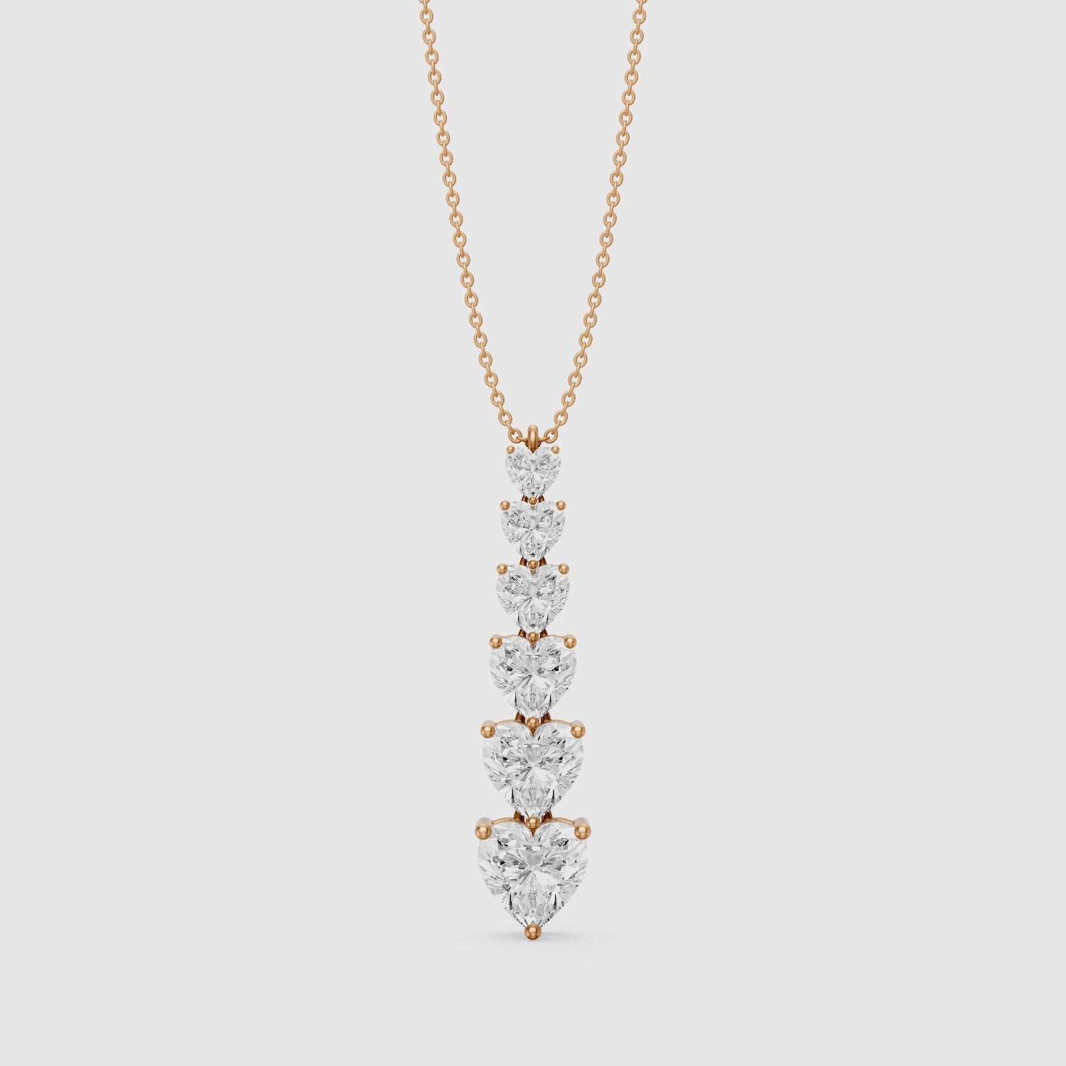 Load video: Effie Graduated Heart Shape Lab Grown Diamond Drop Pendant