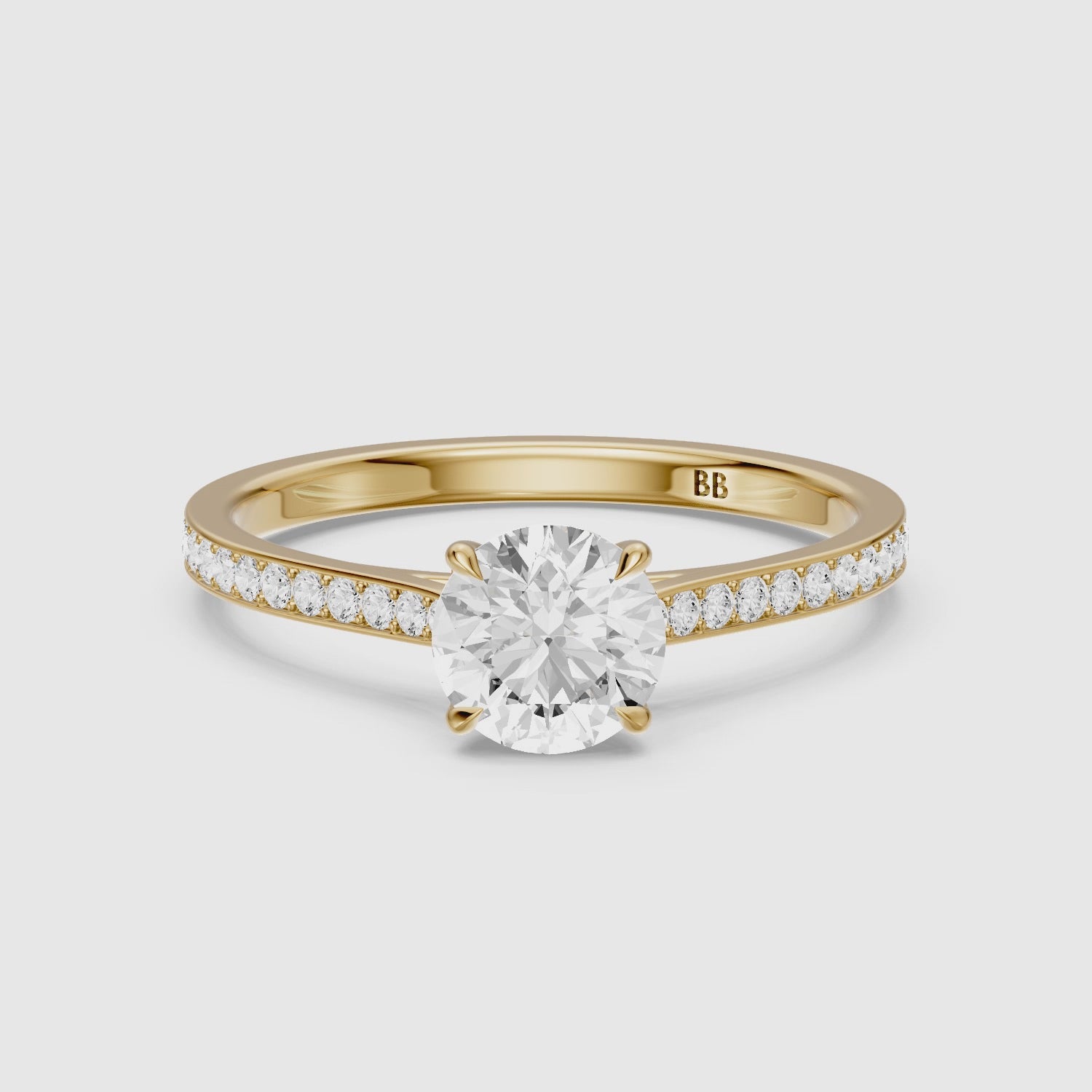 Load video: Jolene 4 Prong Round Cut Side Stone Channel Set Lab Grown Diamond Ring