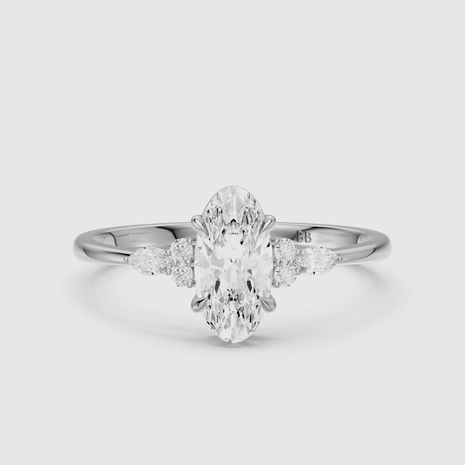 Load video: Estela Moval Moissanite Diamond Ring with Pear and Round Side Stones