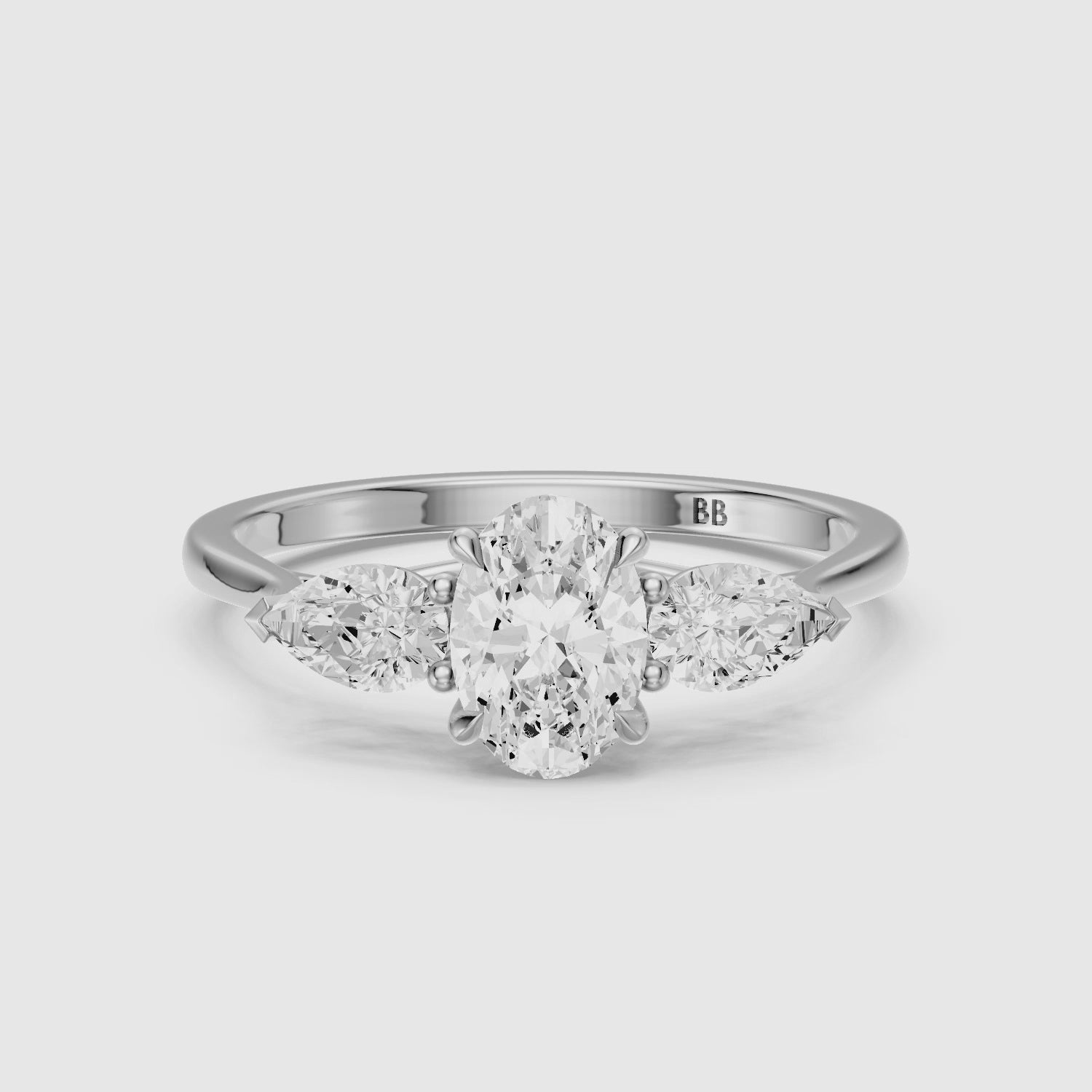 Load video: Ashlyn Three Stone Oval With Pear Side Stone Lab Grown Diamond Ring