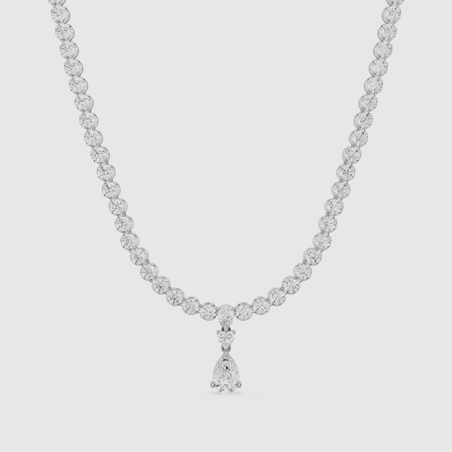 Load video: Raelynn Round Bezel Lab Grown Diamond Pear Drop Tennis Necklace