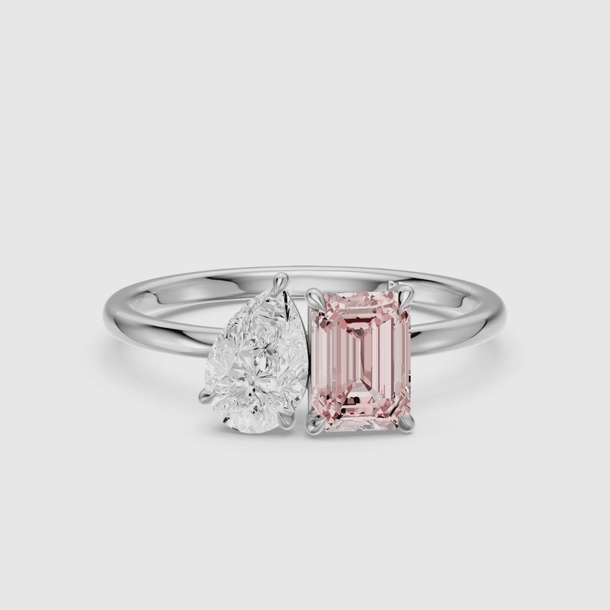 Load video: Kiara Pink Emerald Cut and Pear Shape Color Lab Grown Diamond Toi et Moi Ring