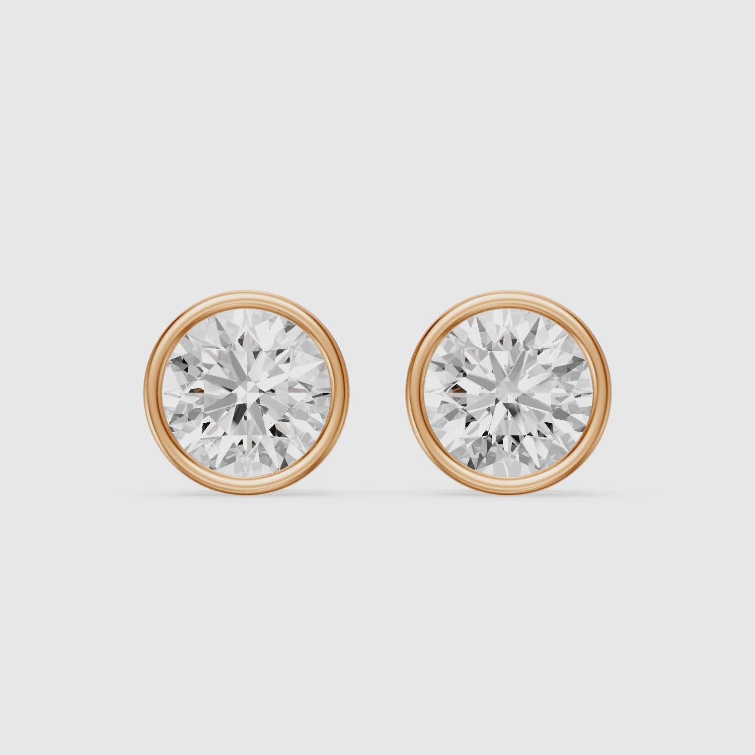 Load video: Meliora Round Cut Lab Grown Diamond Solitaire Bezel Stud Earrings
