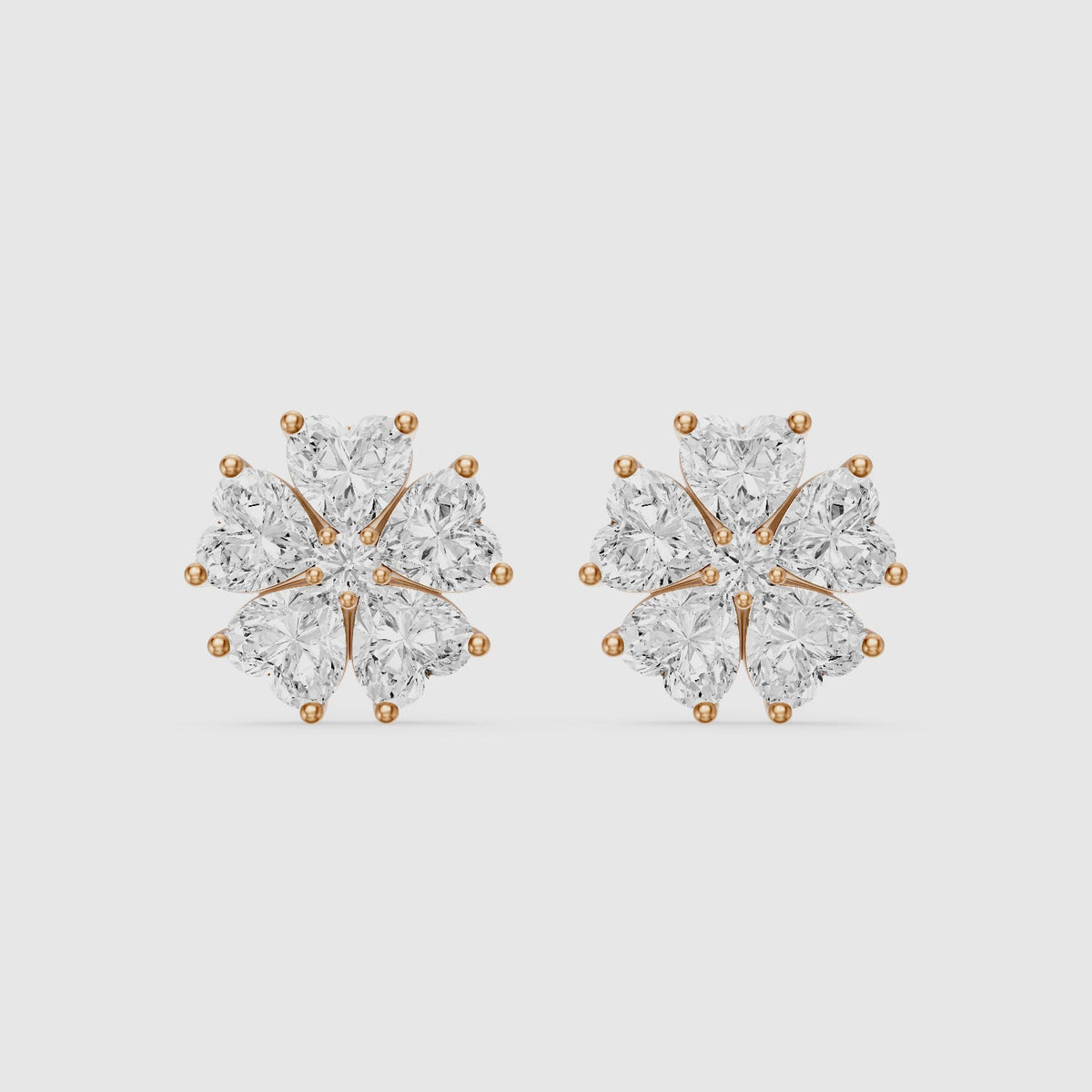 Load video: Zinnia Heart Shape Lab Grown Diamond Five Petal Flower Cluster Stud Earrings