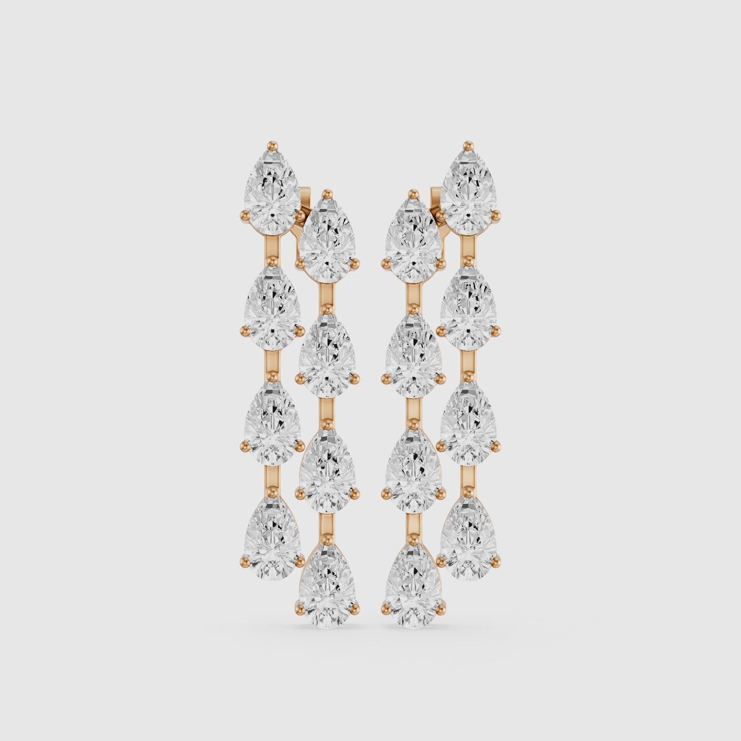 Load video: Eadie Cascading Pear Shaped Lab Grown Diamond Dangle Earrings