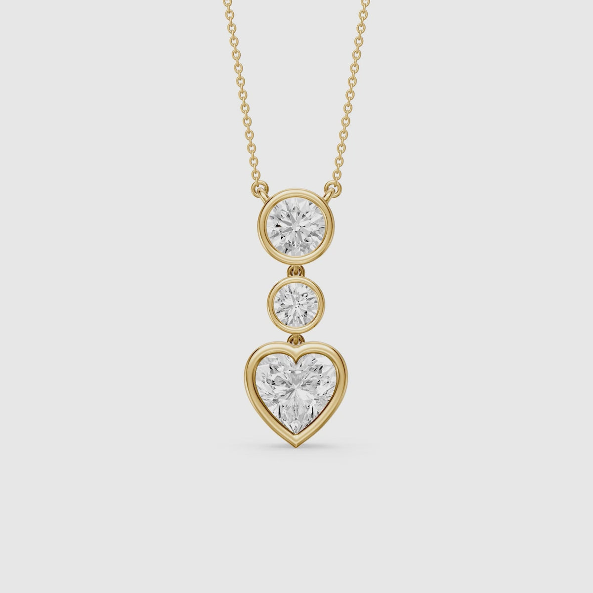 Load video: Ivory Heart Shape and Round Lab Grown Diamond Bezel Drop Pendant