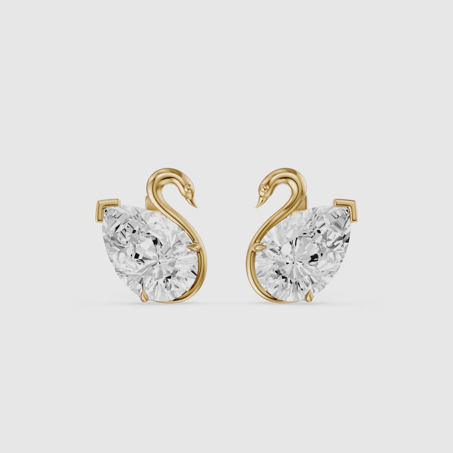 Load video: Solene Pear Cut Lab Grown Diamond Swan Stud Earrings