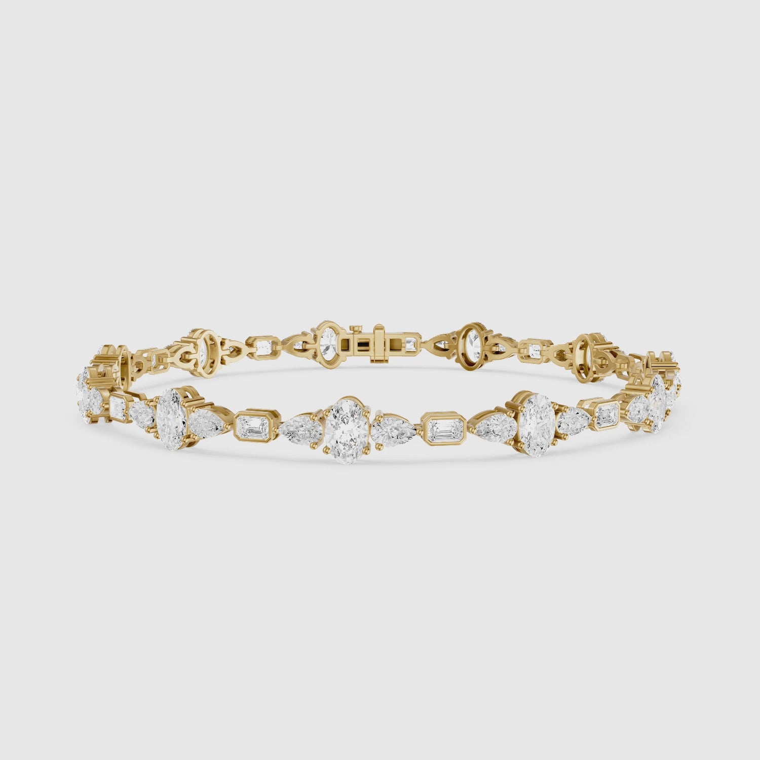 Load video: Remy Pear Oval with Bezeled Emerald Cut Lab Grown Diamond Tennis Bracelet