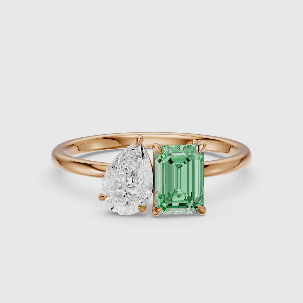 Load video: Belle Green Emerald Cut and Pear Shape Color Lab Grown Diamond Toi et Moi Ring