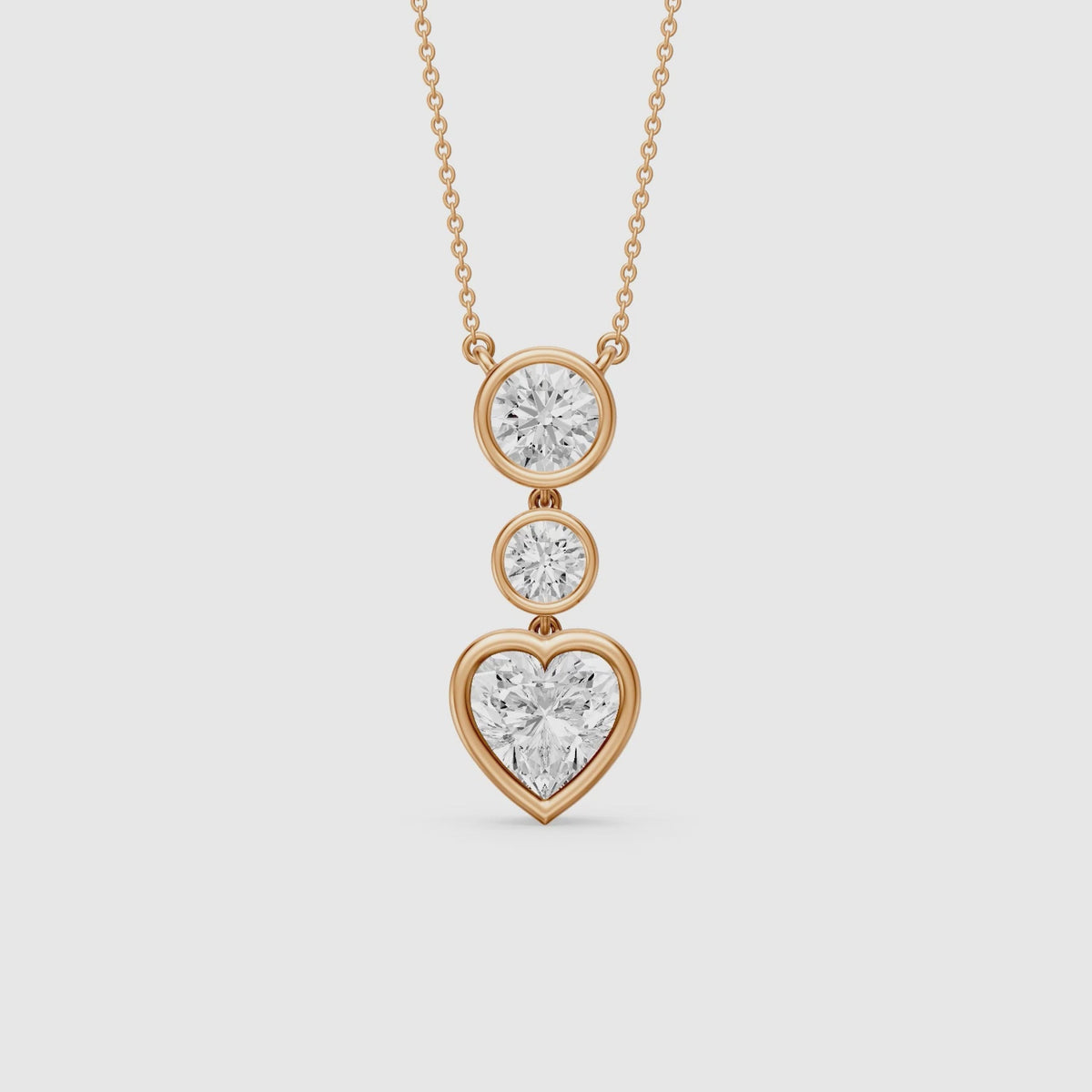 Load video: Ivory Heart Shape and Round Lab Grown Diamond Bezel Drop Pendant