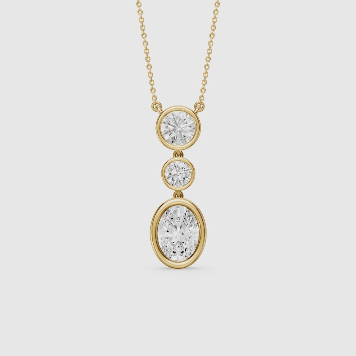 Load video: Malani Oval Cut and Round Cut Bezel Lab Grown Diamond Drop Pendant