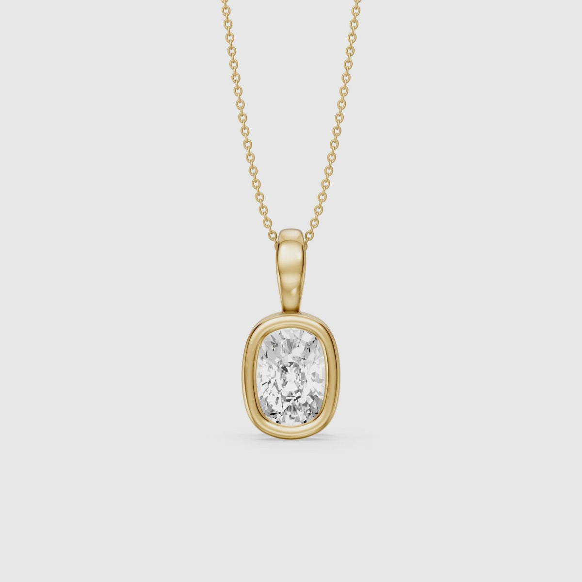 Load video: Lizzy Elongated Cushion Bezel Lab Grown Diamond Solitaire Pendant