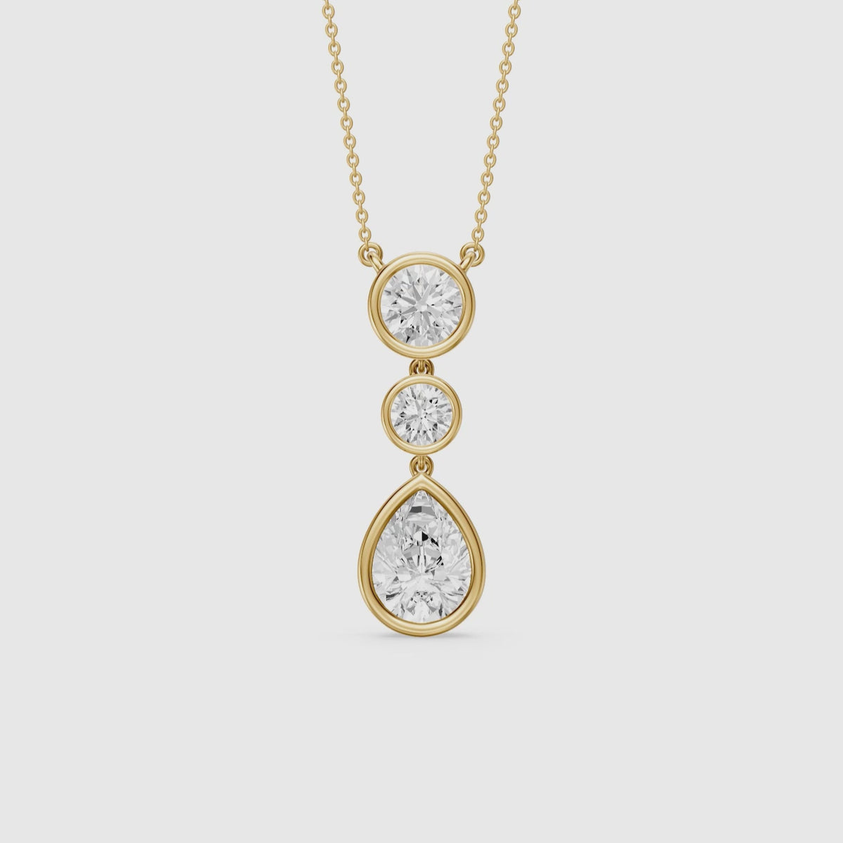 Load video: Anya Pear Shape and Round Bezel Drop Lab Grown Diamond Pendant
