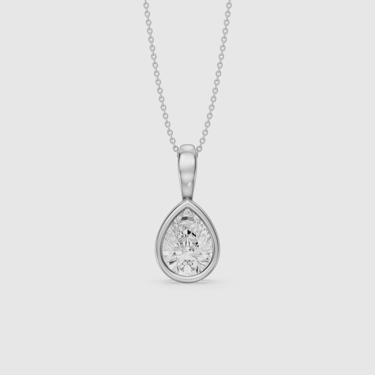 Load video: Mary Pear Shape Bezel Set Lab Grown Diamond Solitaire Pendant