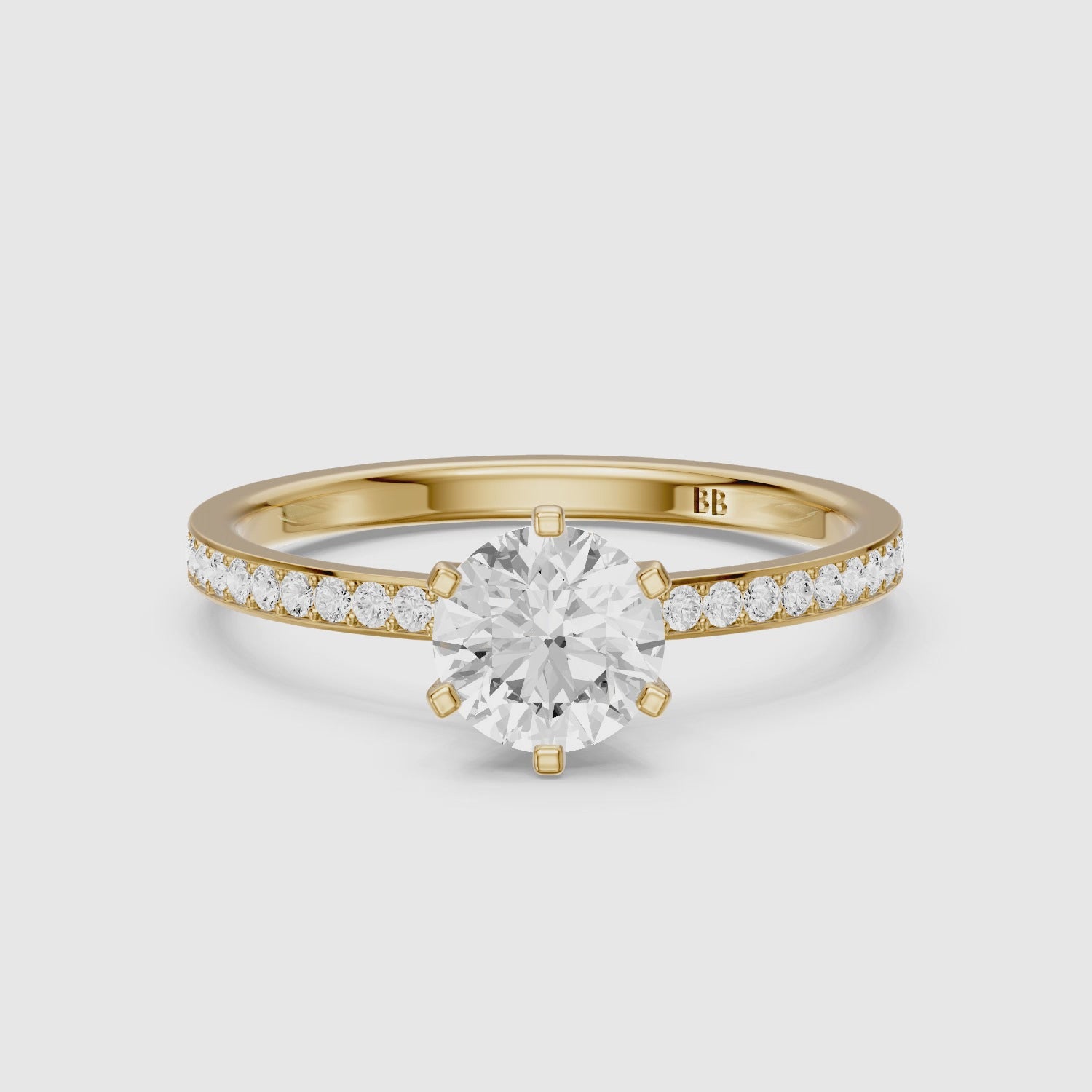 Load video: Keegan 6 Prong Round Cut Channel Set Moissanite Diamond Ring