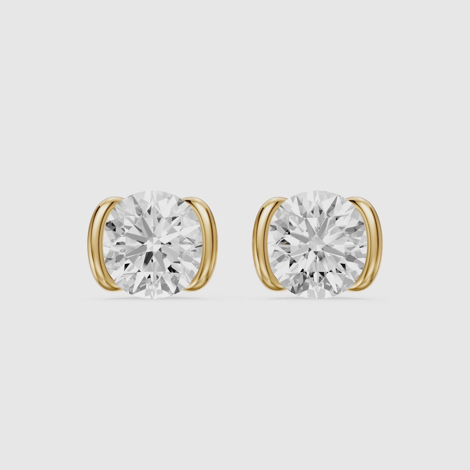 Load video: Aina Round Cut Lab Grown Diamond half Bezel Stud Earrings