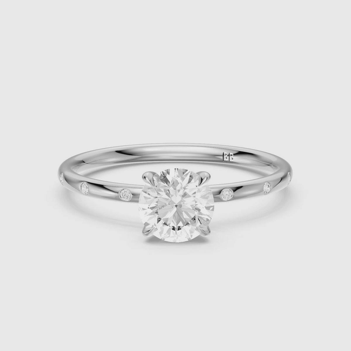Load video: Calia Round Solitaire Lab Grown Diamond Engagement Ring with Flush Band