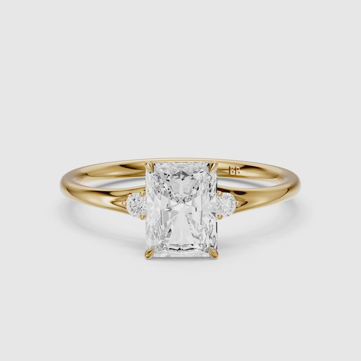 Load video: Lumi Radiant Cut Side Stone Sculptural Moissanite Diamond Ring