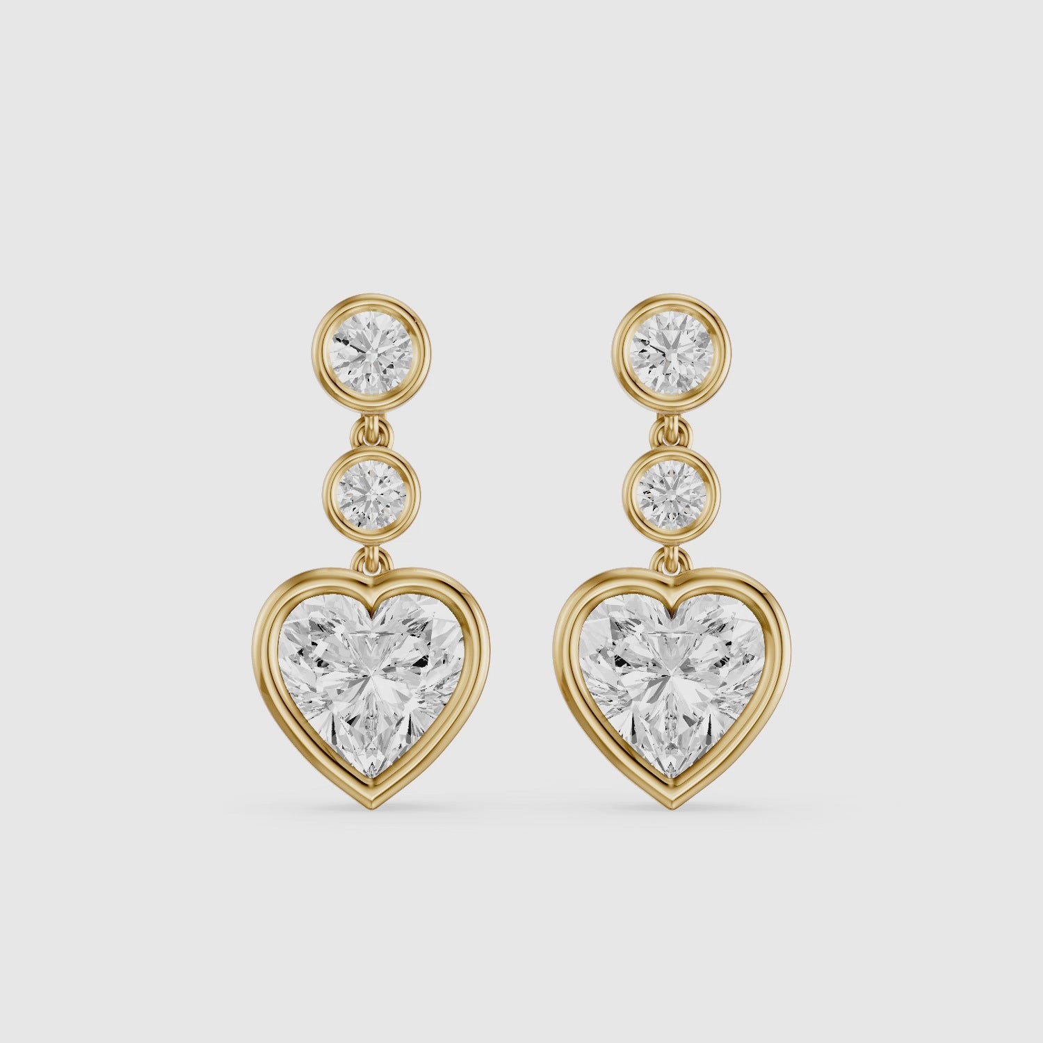 Load video: Ava Heart Shape and Round Lab Grown Diamond Bezel Drop Earrings