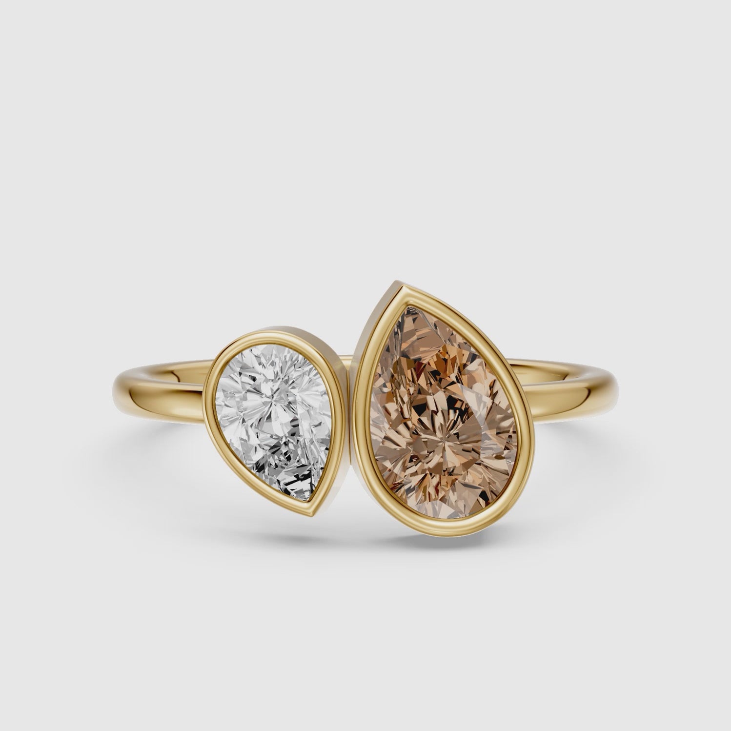 Load video: Ottilie Champagne and White Pear Cut Colored Lab Grown Diamond Toi et Moi Bezel Ring
