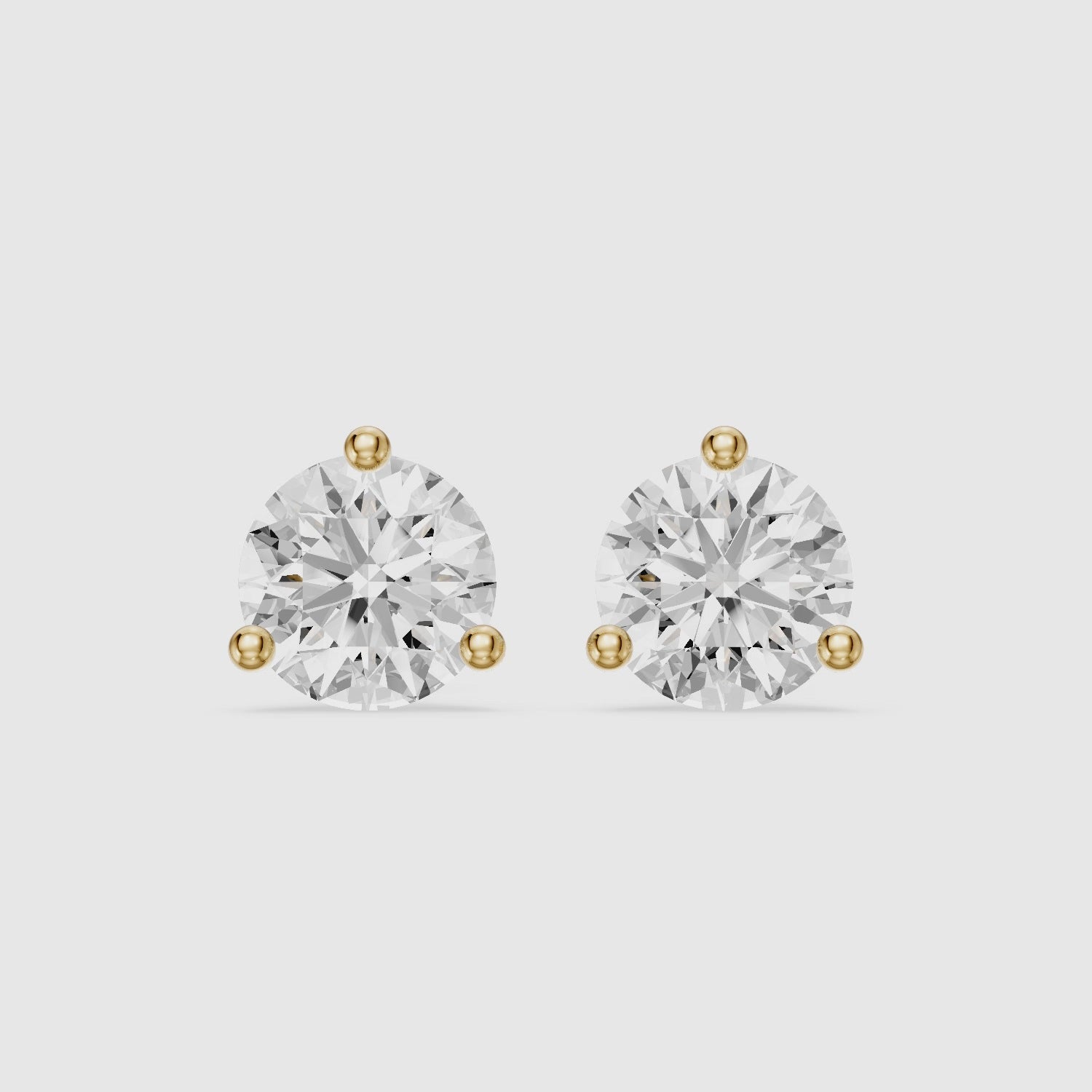 Load video: Gaia Round Cut Lab Grown Diamond Three Prong Martini Stud Earrings
