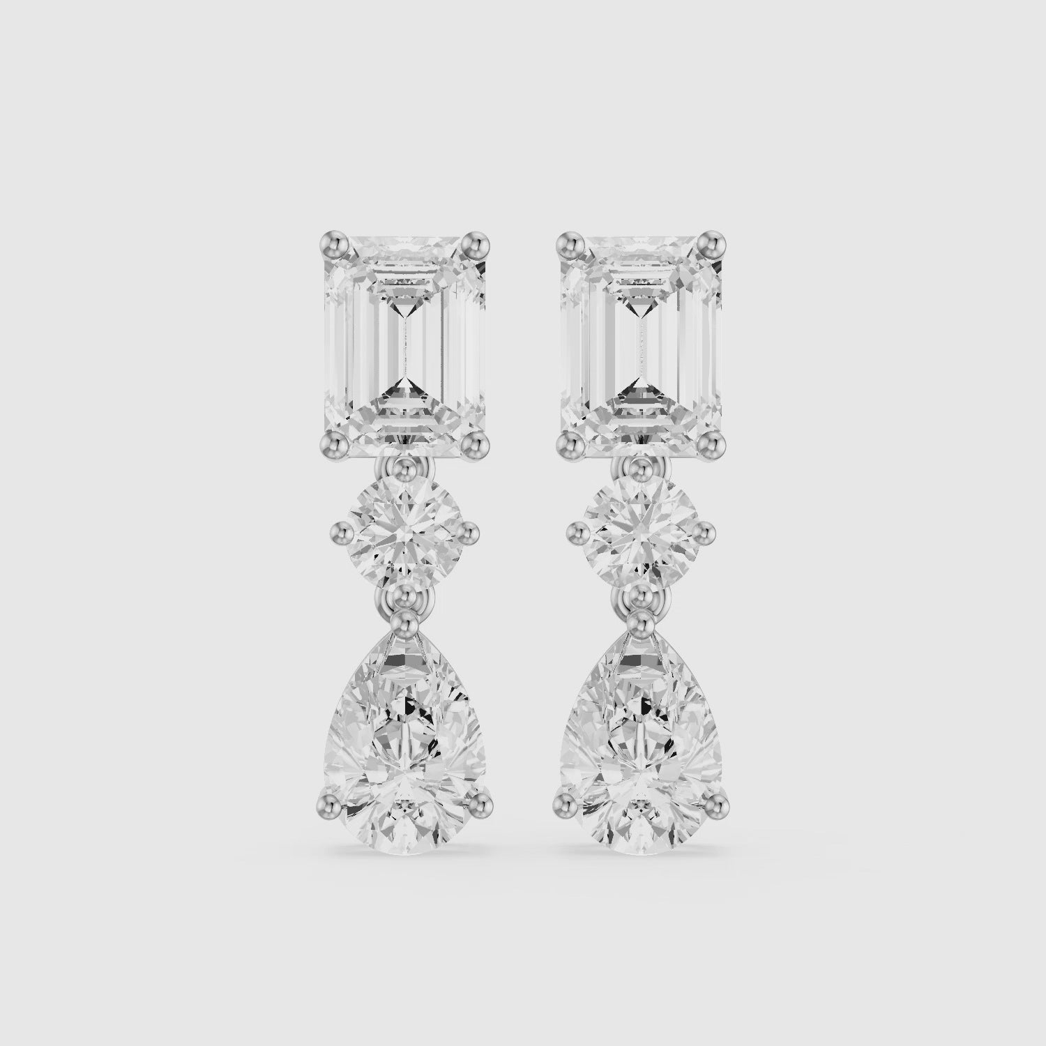 Load video: Gracelyn Emerald, Round and Pear Cut Lab Grown Diamond Dangle Earrings