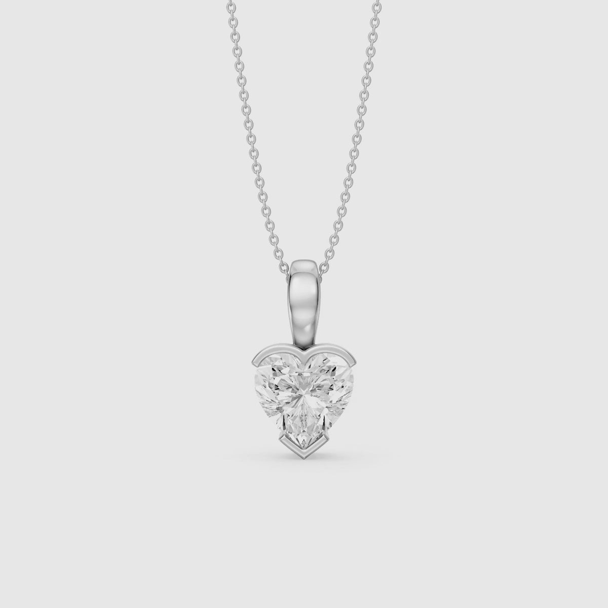 Load video: Jordyn Heart Shape Lab Grown Diamond Half Bezel Pendant