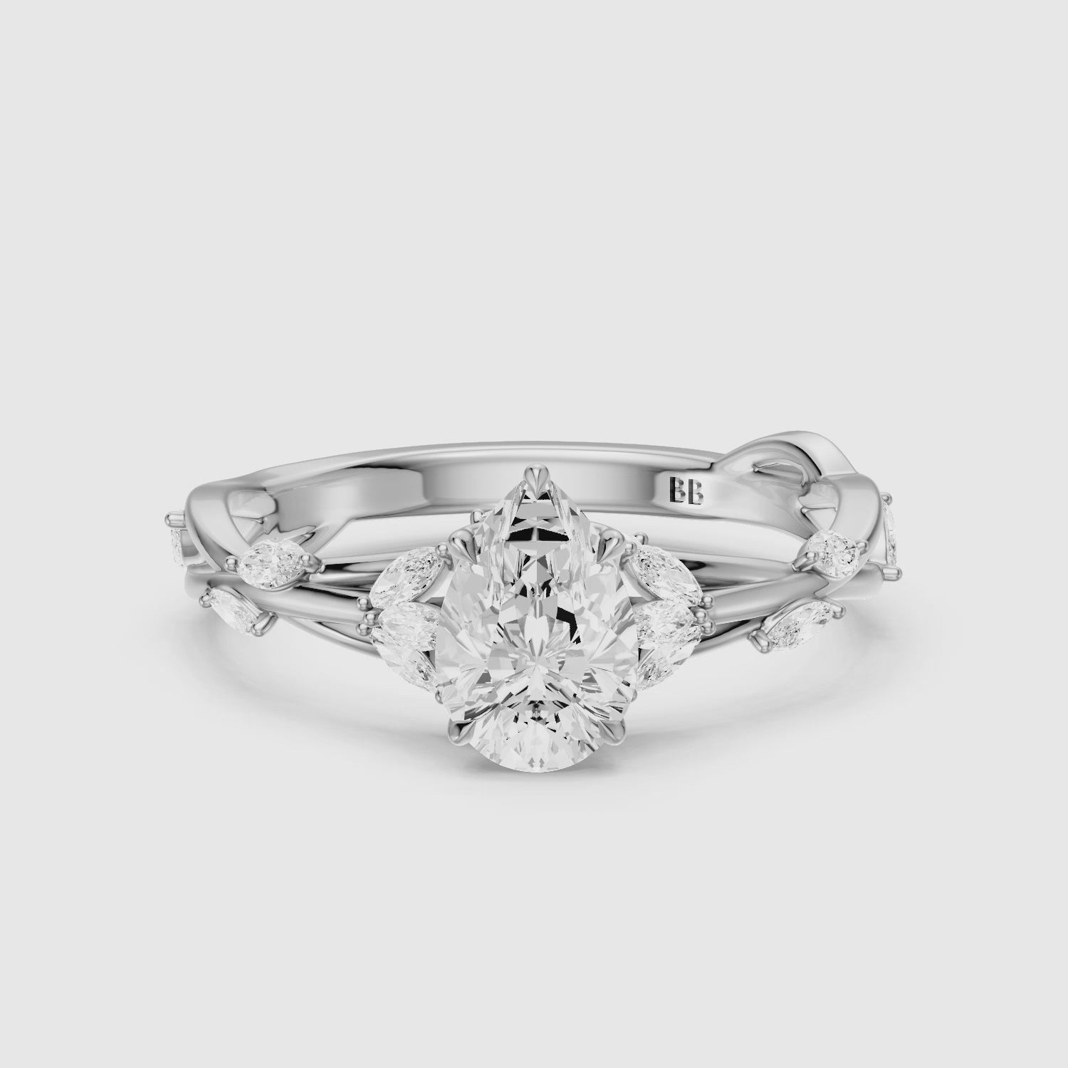 Load video: Luna Pear Cut Marquise Side Stone Nature Inspired Moissanite Diamond Ring
