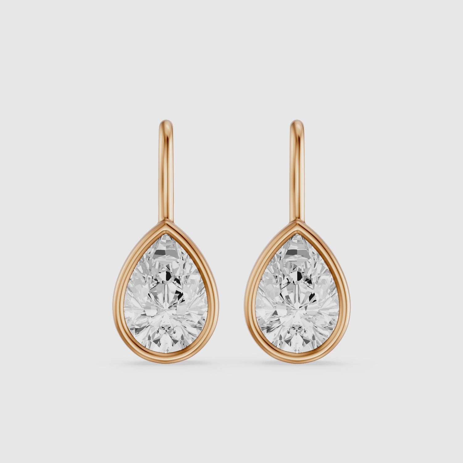 Load video: Brinley Bezel Set Pear Lab Grown Diamond Drop Earrings